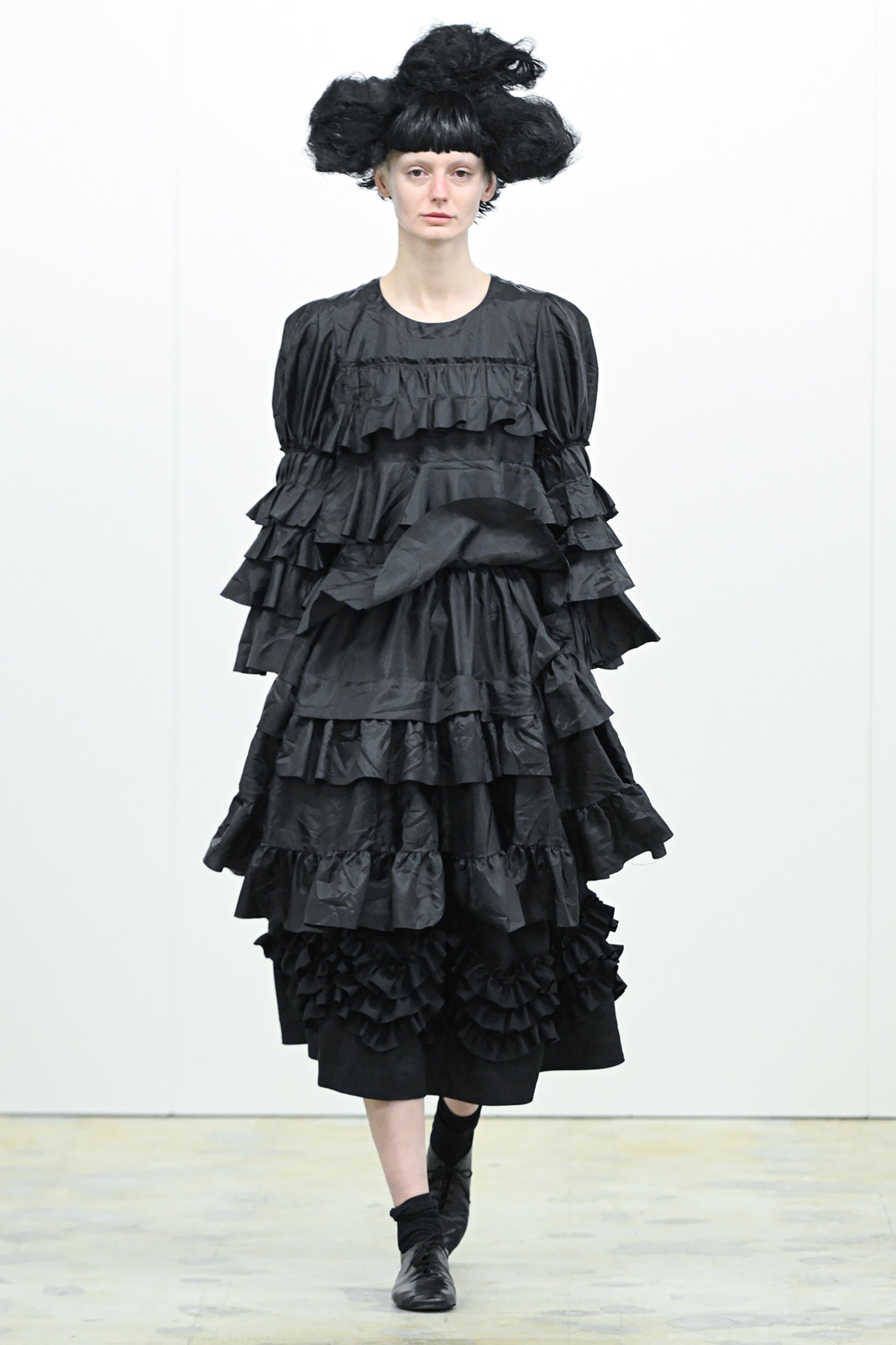 Fashion model wearing a COMME DES GARÇONS COMME DES GARÇONS AW26 outfit
