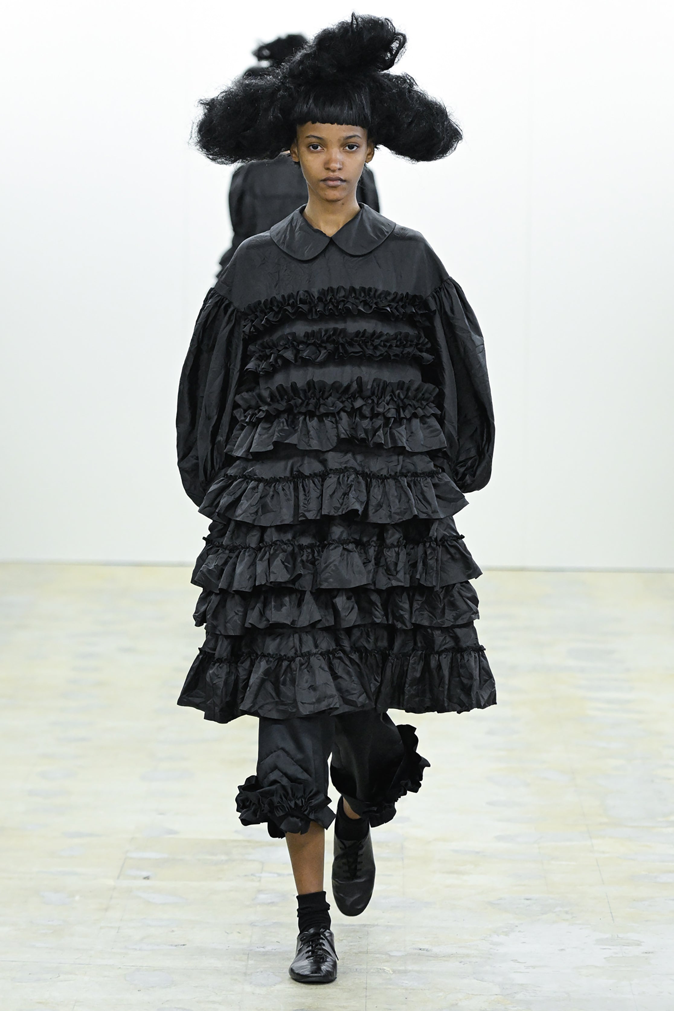 Fashion model wearing a COMME DES GARÇONS COMME DES GARÇONS AW26 outfit
