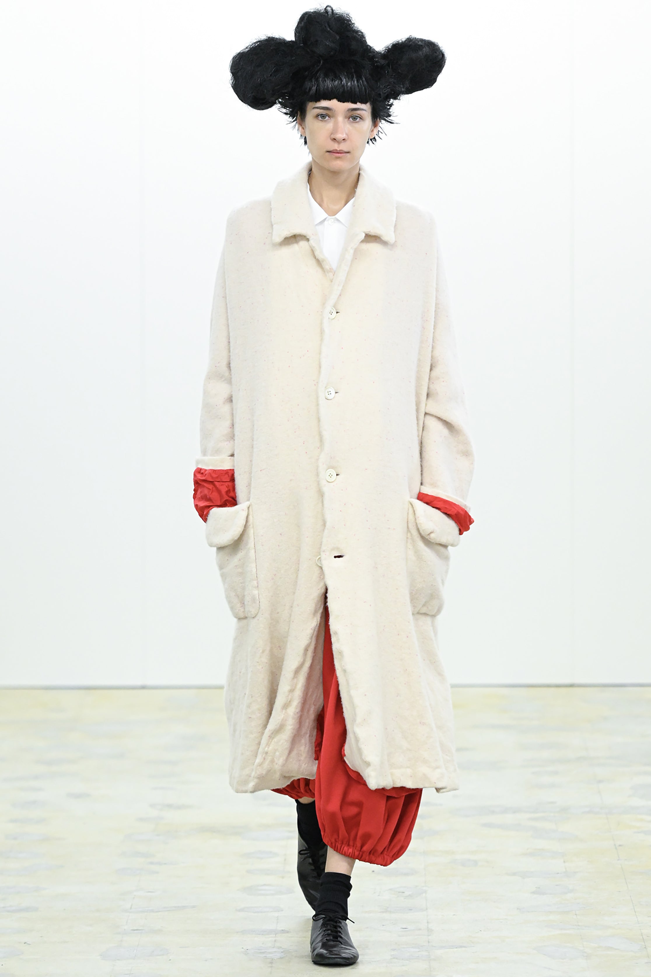 Fashion model wearing a COMME DES GARÇONS COMME DES GARÇONS AW26 outfit