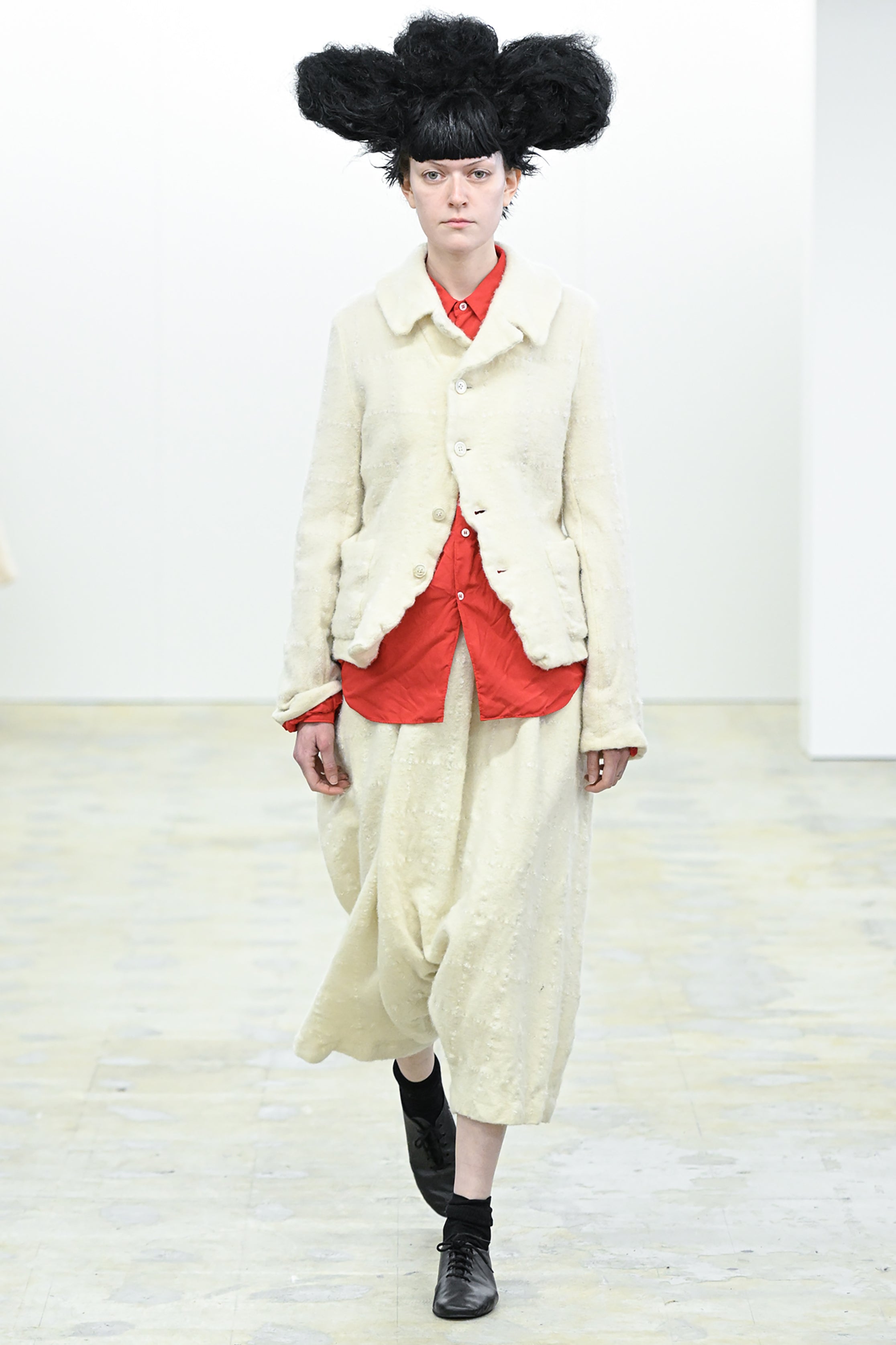 Fashion model wearing a COMME DES GARÇONS COMME DES GARÇONS AW26 outfit