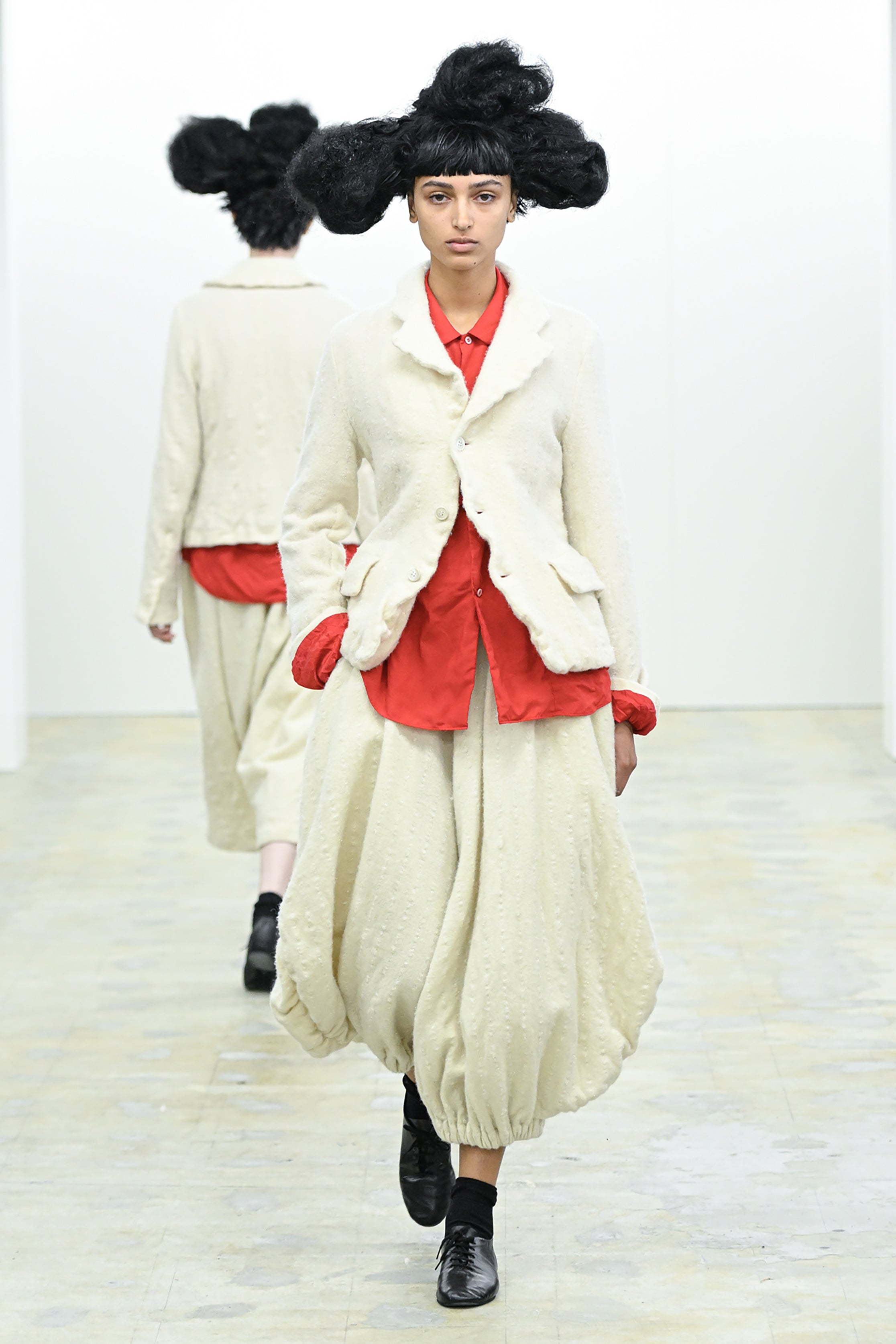 Fashion model wearing a COMME DES GARÇONS COMME DES GARÇONS AW26 outfit