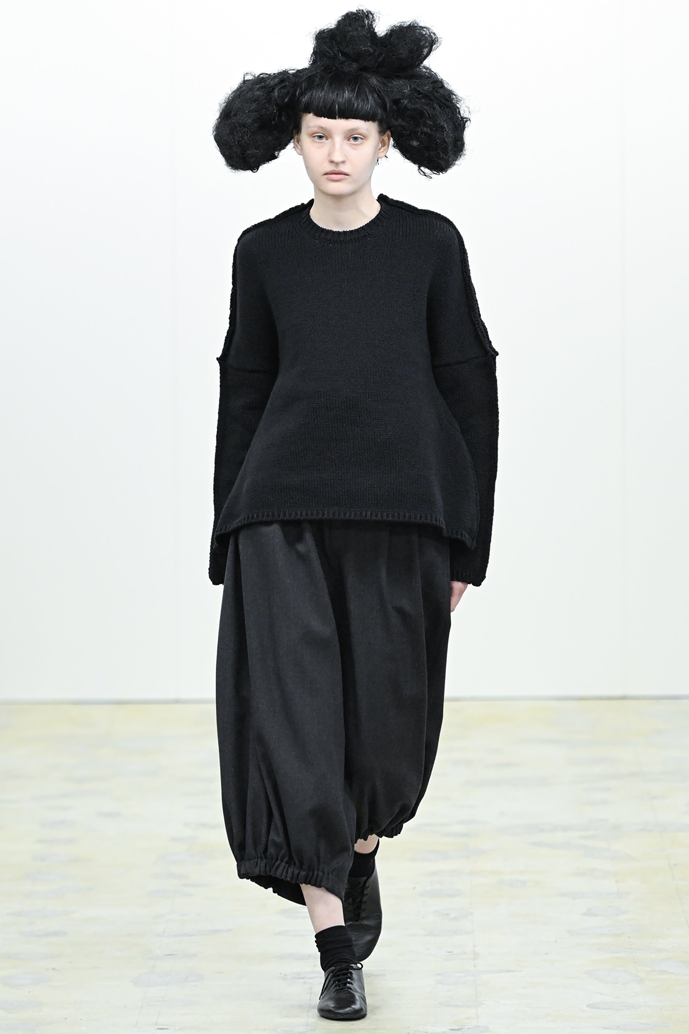 Fashion model wearing a COMME DES GARÇONS COMME DES GARÇONS AW26 outfit