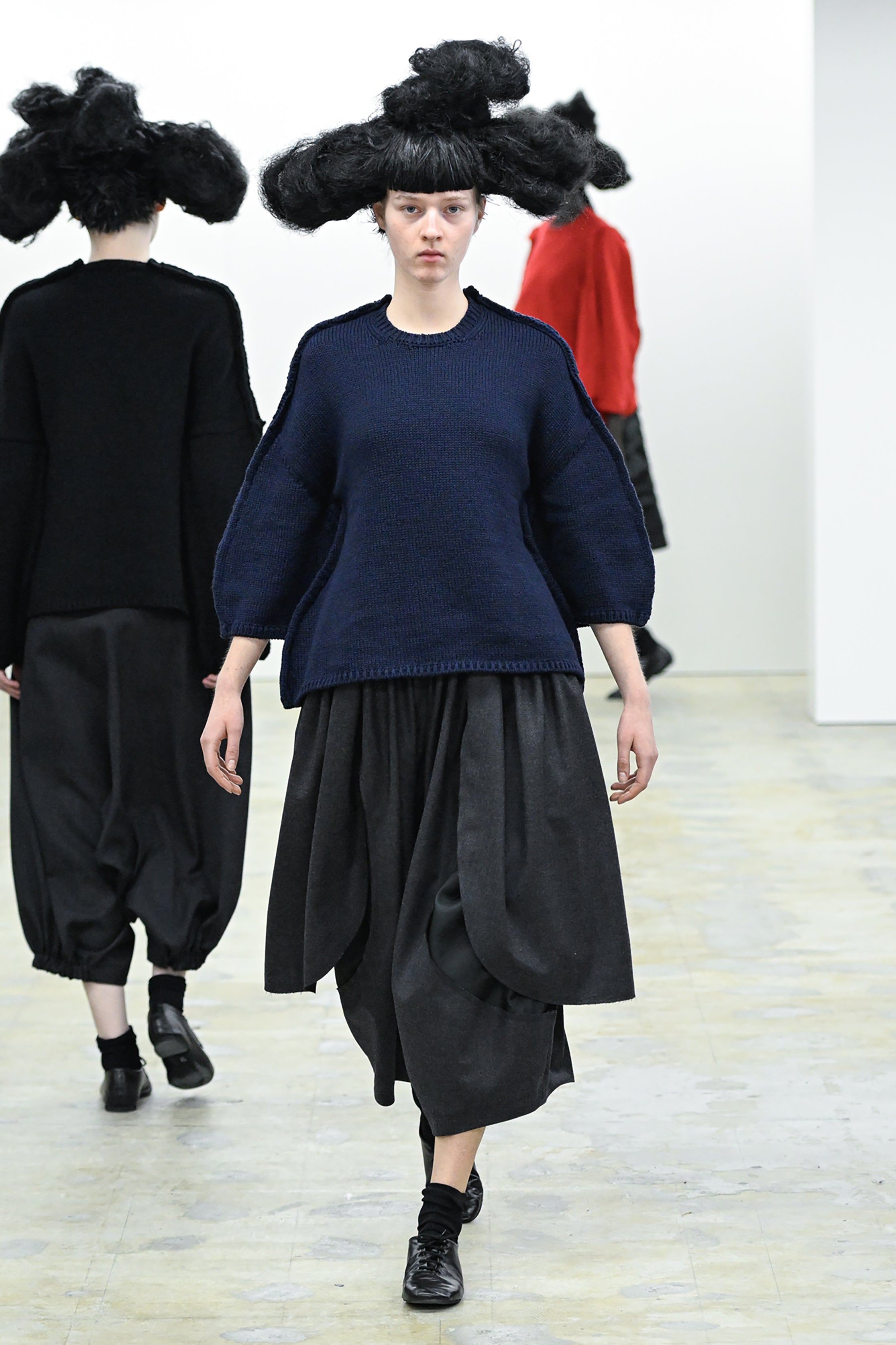 Fashion model wearing a COMME DES GARÇONS COMME DES GARÇONS AW26 outfit