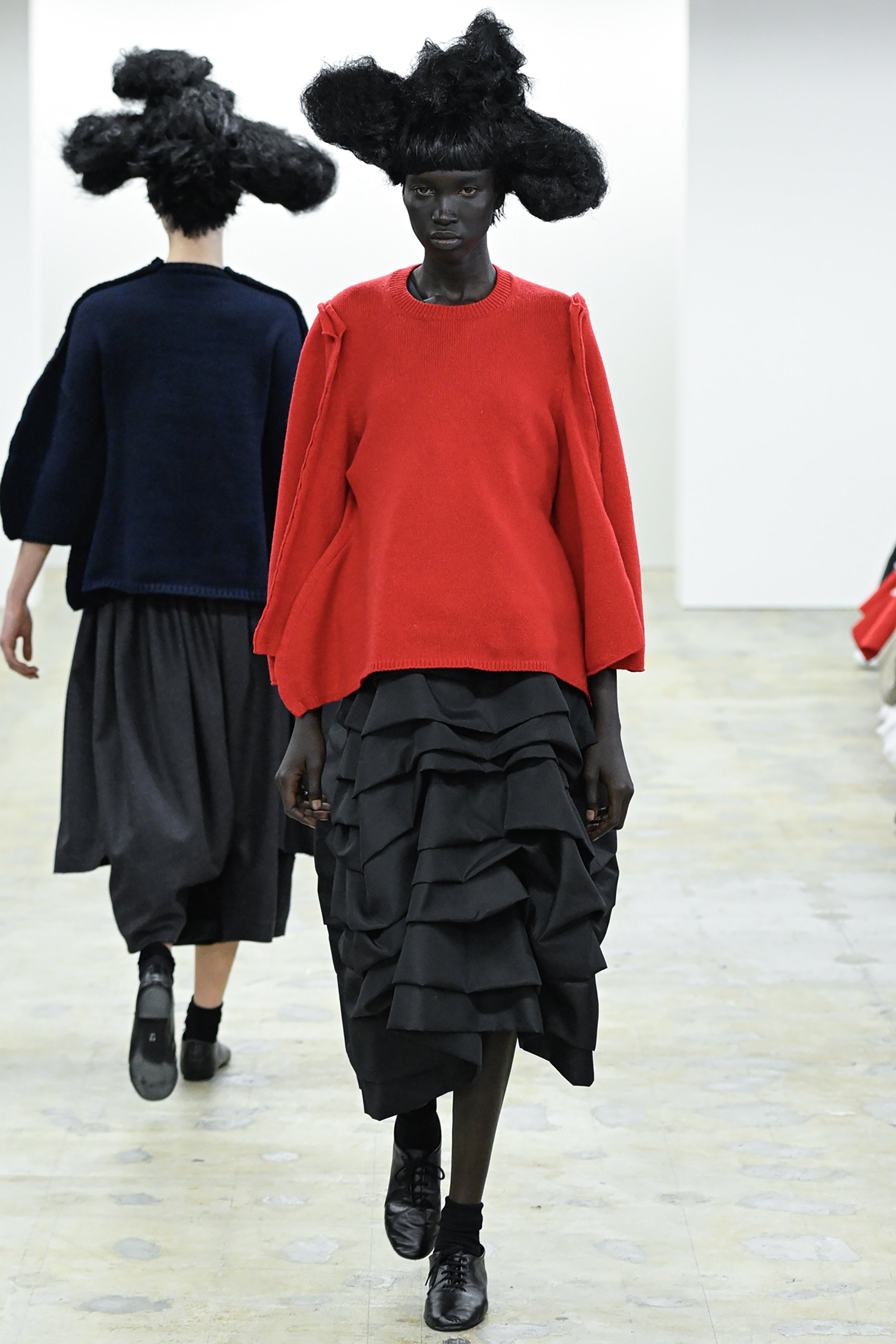 Fashion model wearing a COMME DES GARÇONS COMME DES GARÇONS AW26 outfit