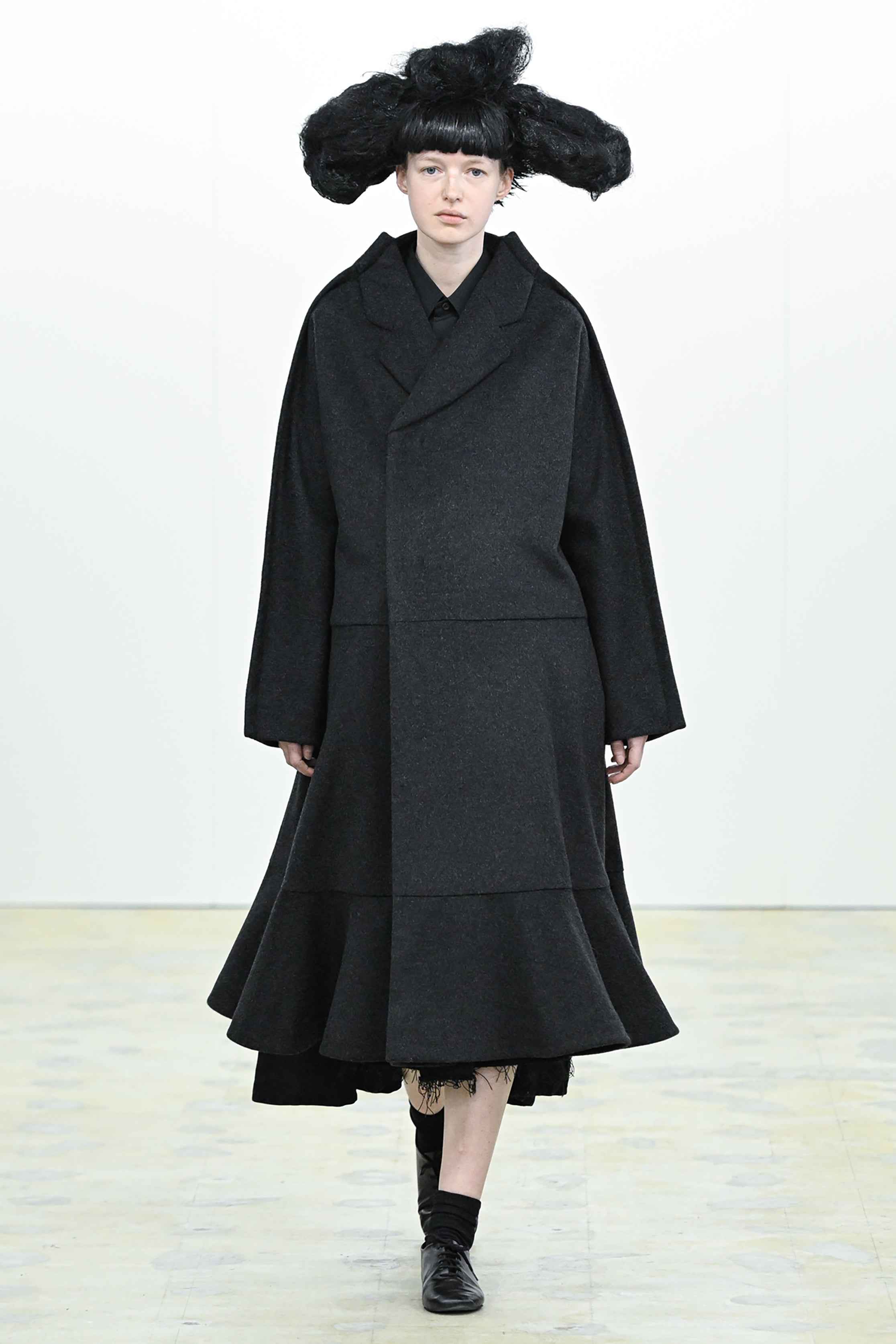 Fashion model wearing a COMME DES GARÇONS COMME DES GARÇONS AW26 outfit