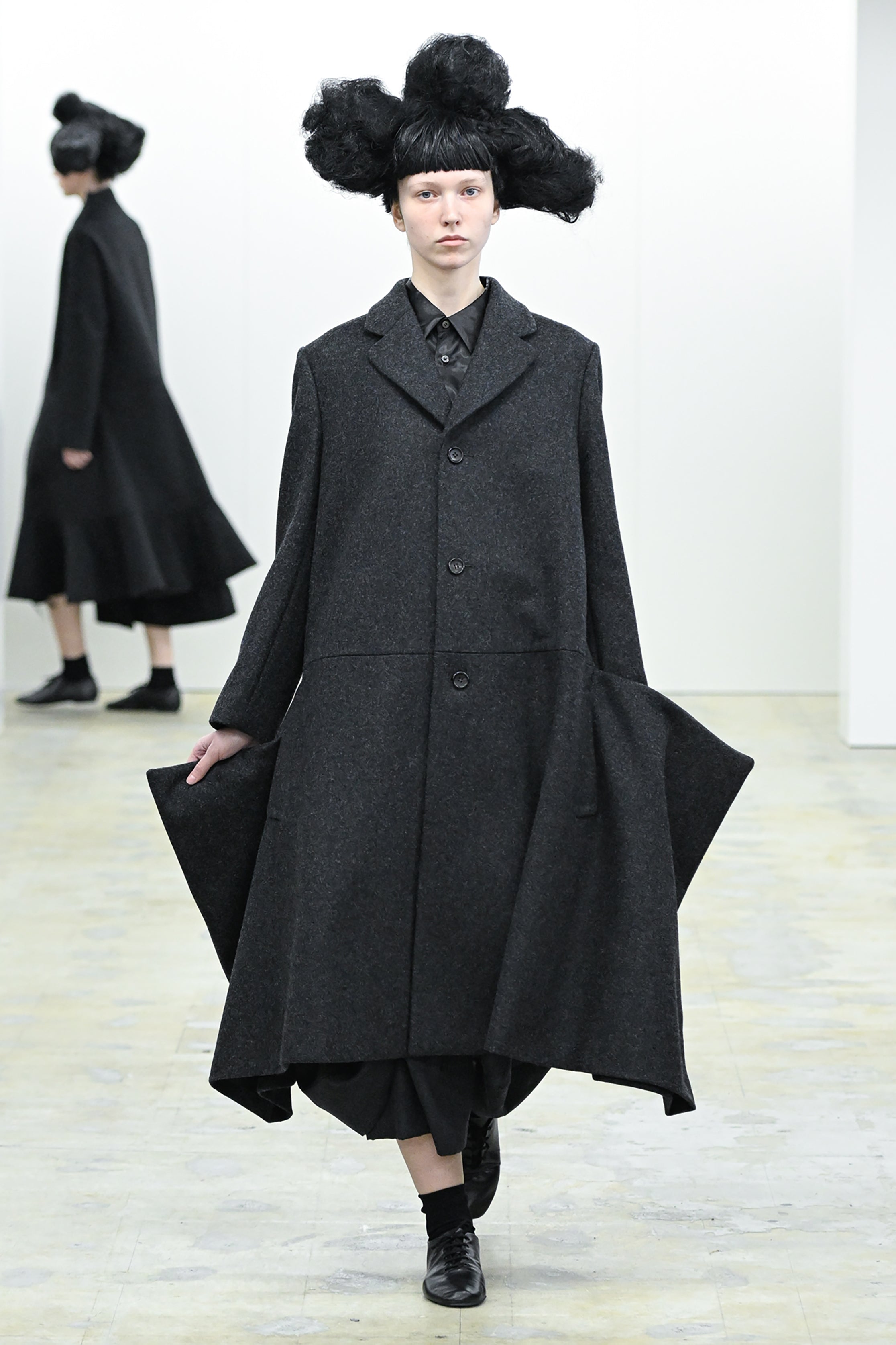Fashion model wearing a COMME DES GARÇONS COMME DES GARÇONS AW26 outfit