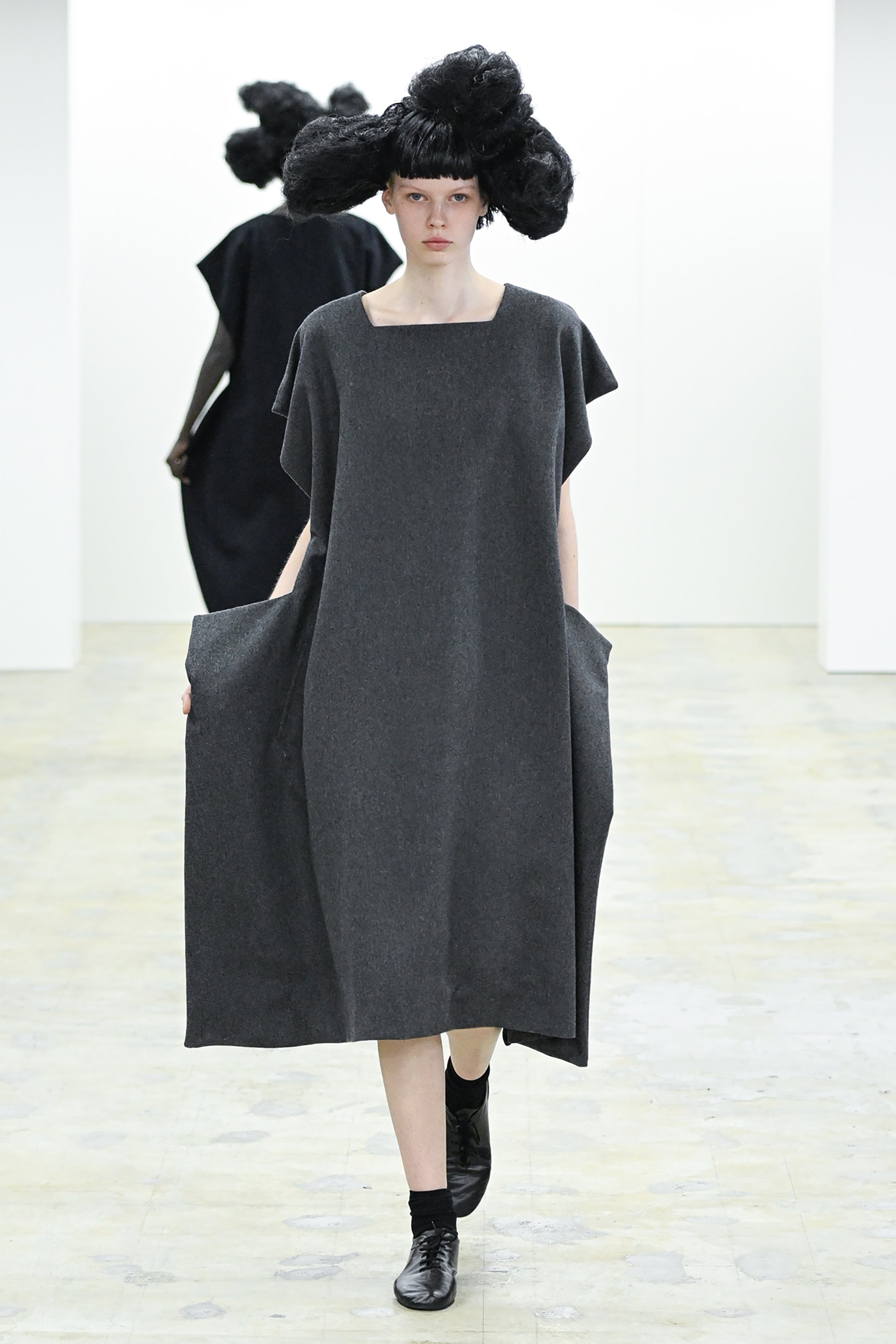 Fashion model wearing a COMME DES GARÇONS COMME DES GARÇONS AW26 outfit