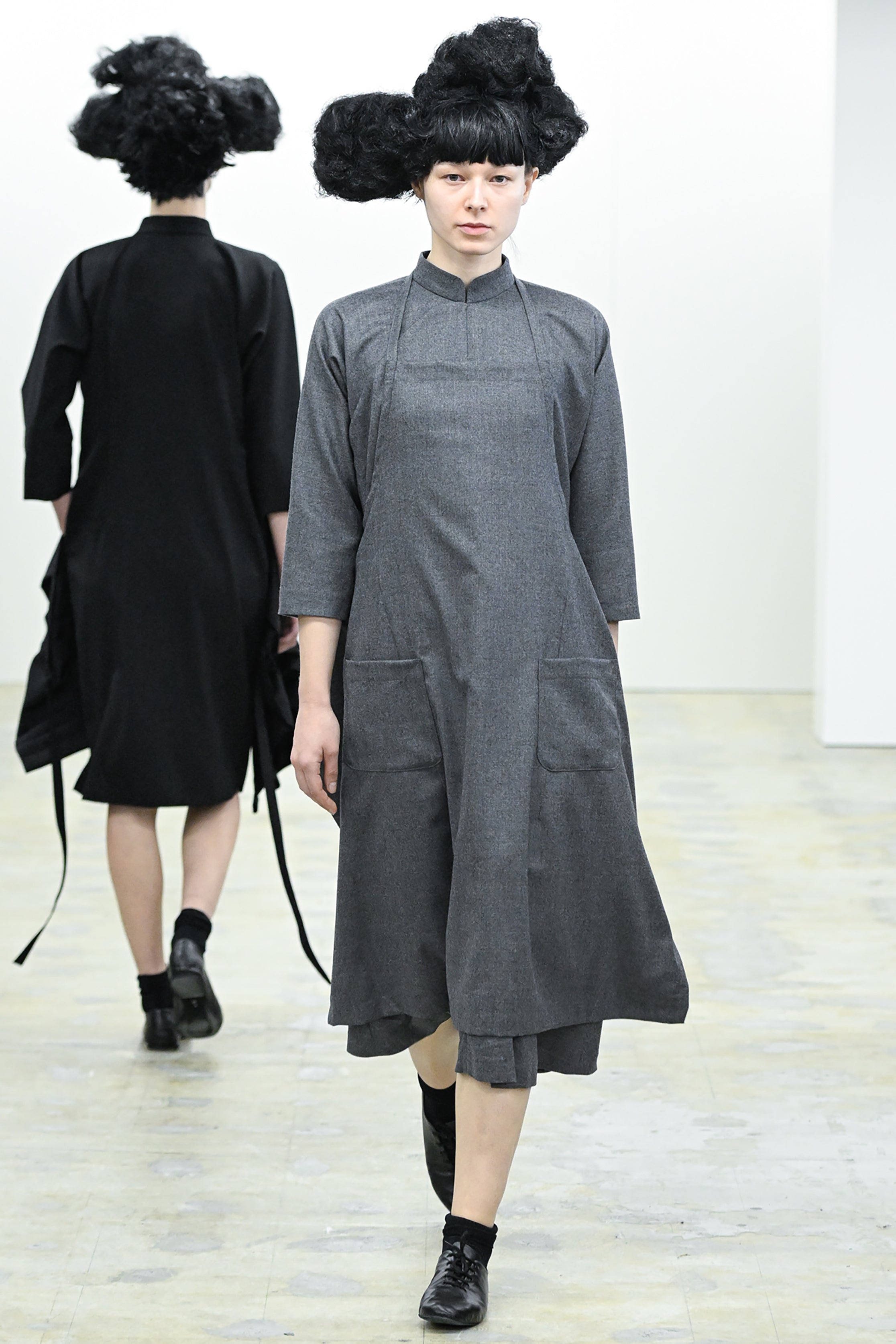 Fashion model wearing a COMME DES GARÇONS COMME DES GARÇONS AW26 outfit