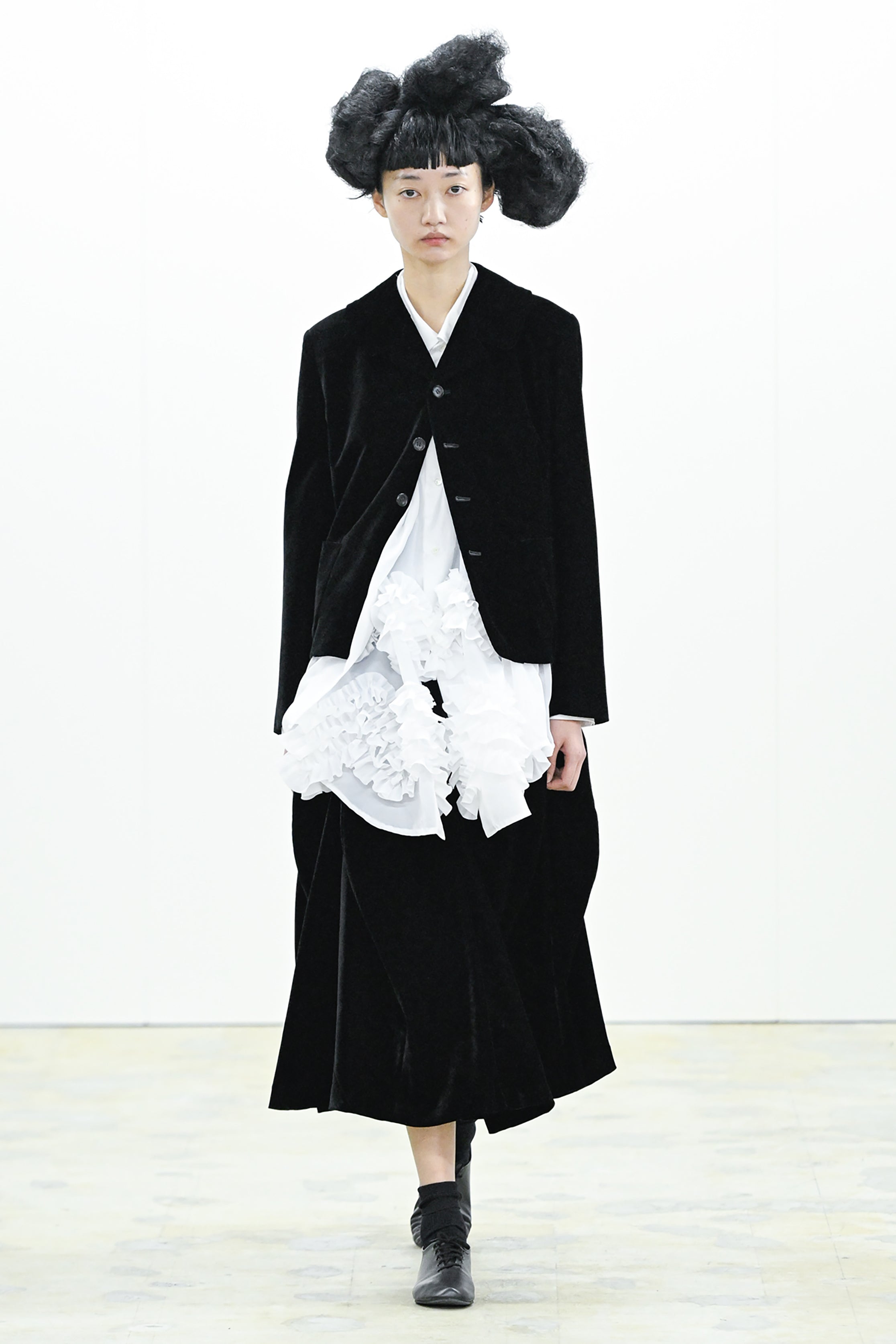 Fashion model wearing a COMME DES GARÇONS COMME DES GARÇONS AW26 outfit