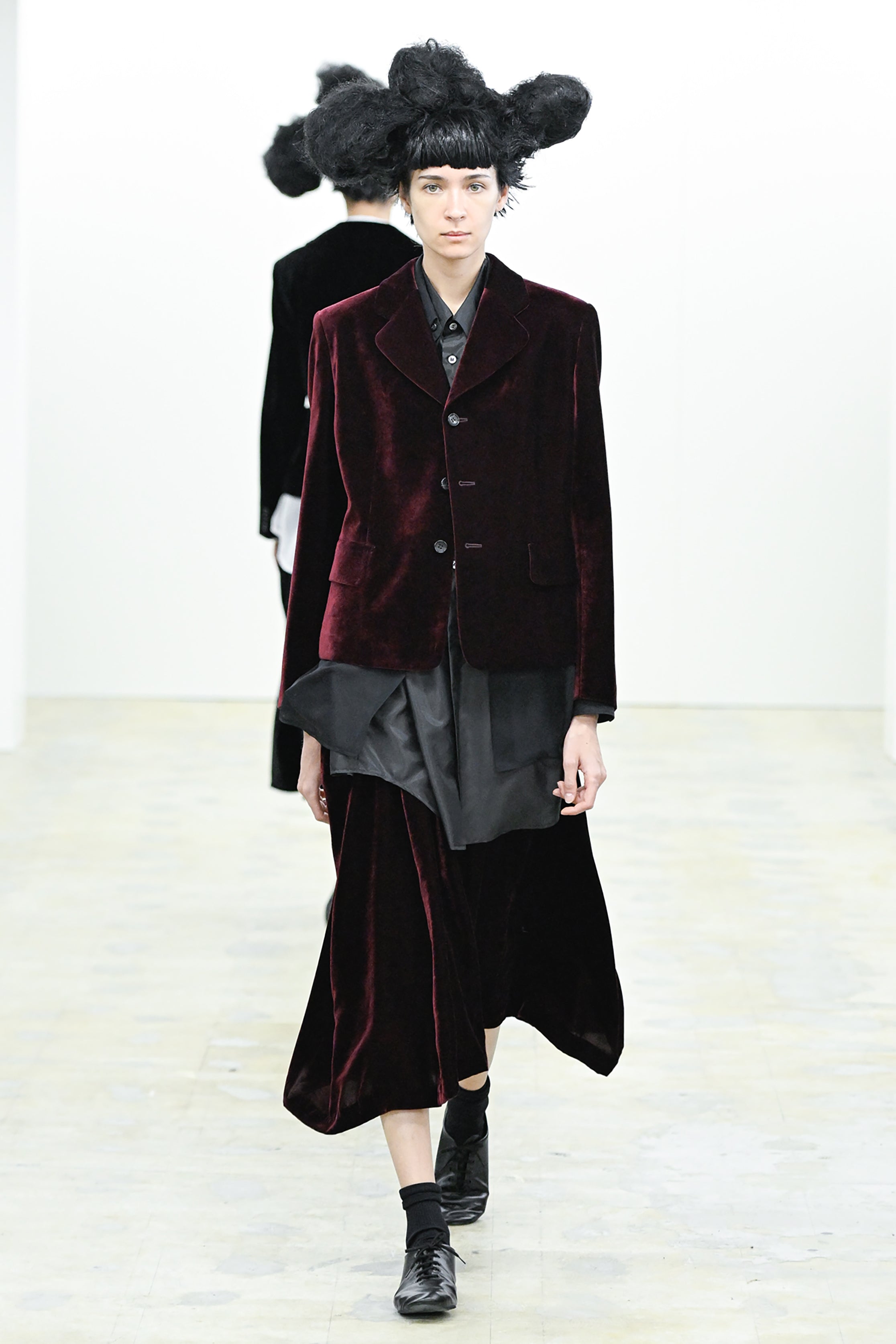 Fashion model wearing a COMME DES GARÇONS COMME DES GARÇONS AW26 outfit