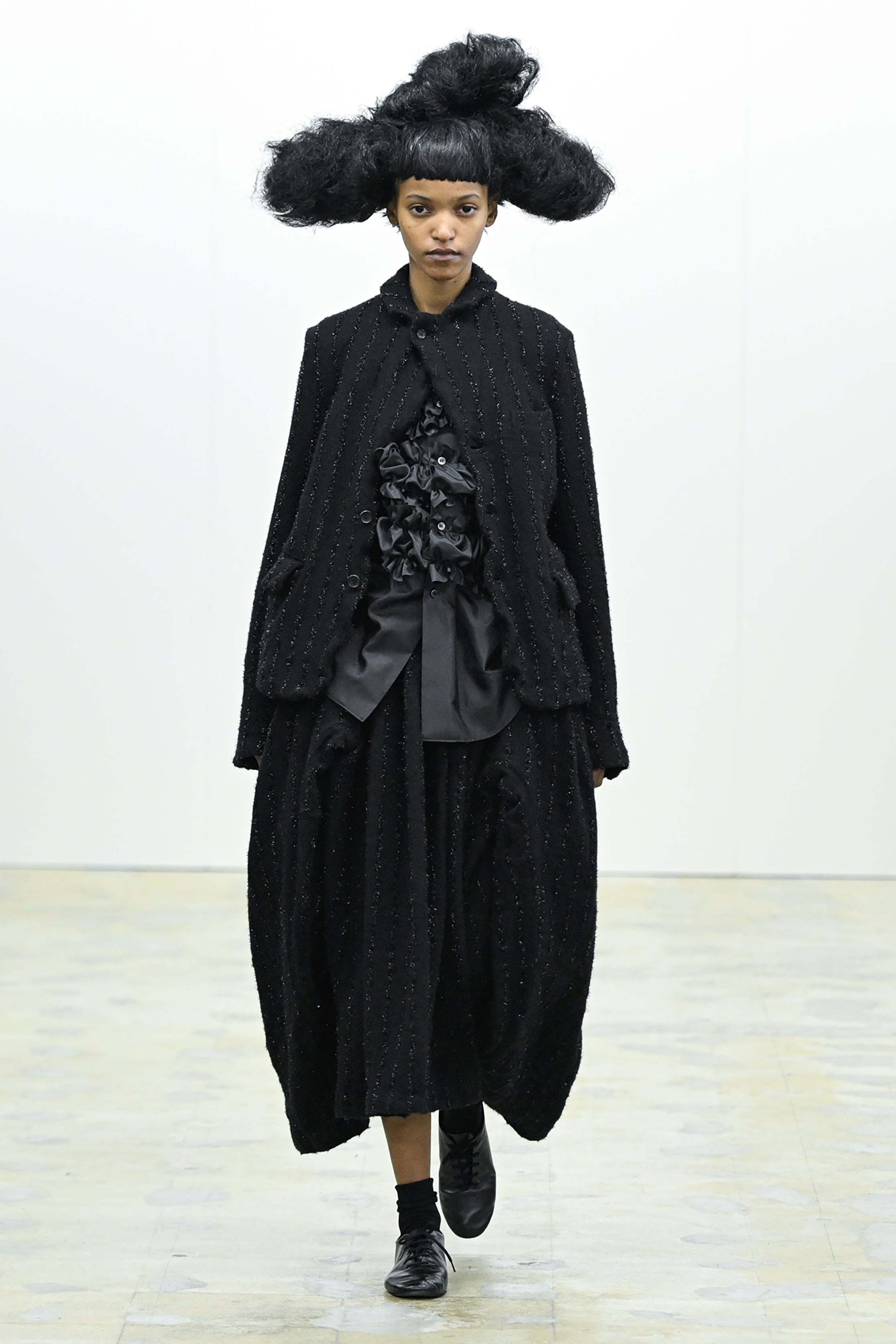 Fashion model wearing a COMME DES GARÇONS COMME DES GARÇONS AW26 outfit