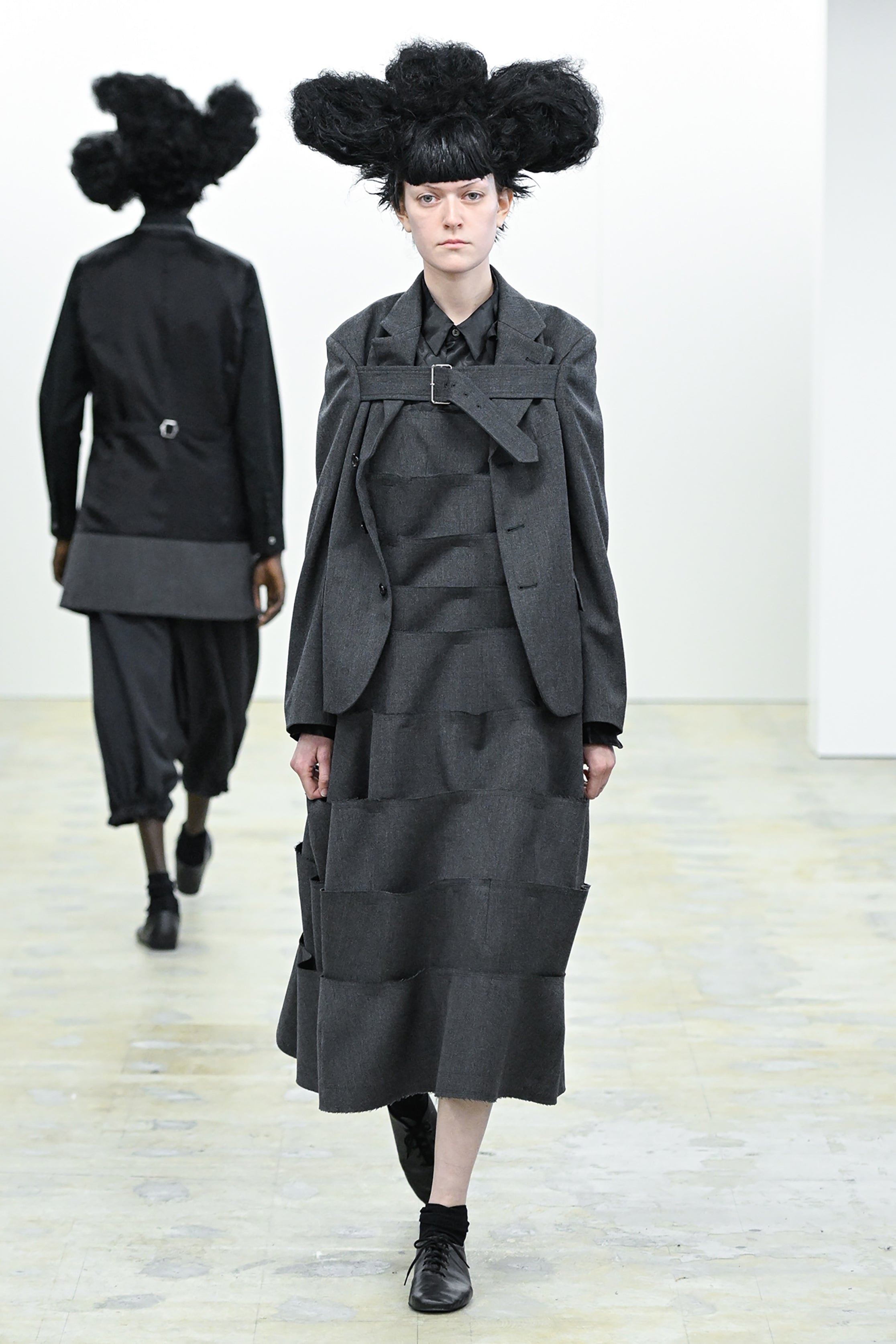 Fashion model wearing a COMME DES GARÇONS COMME DES GARÇONS AW26 outfit