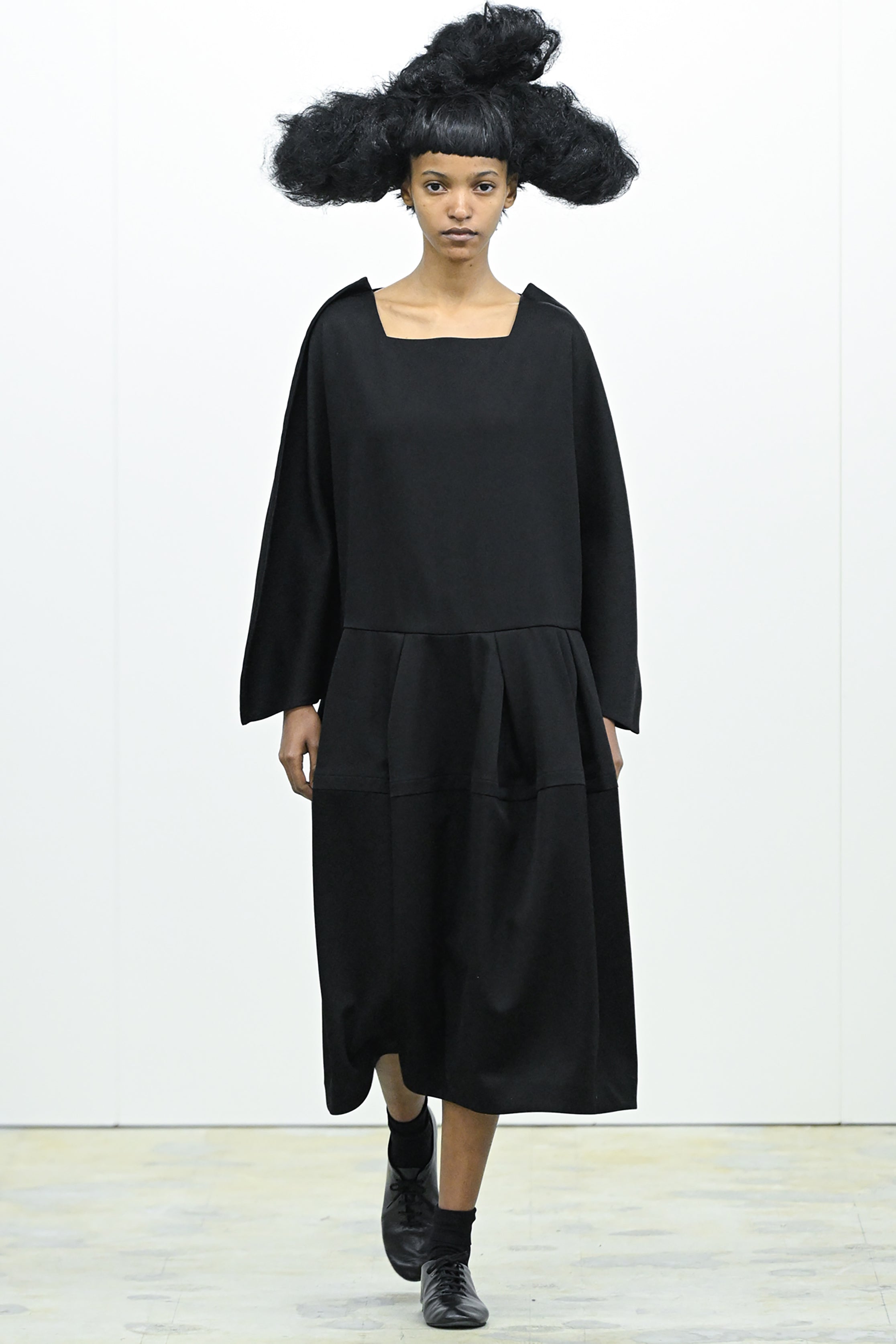 Fashion model wearing a COMME DES GARÇONS COMME DES GARÇONS AW26 outfit