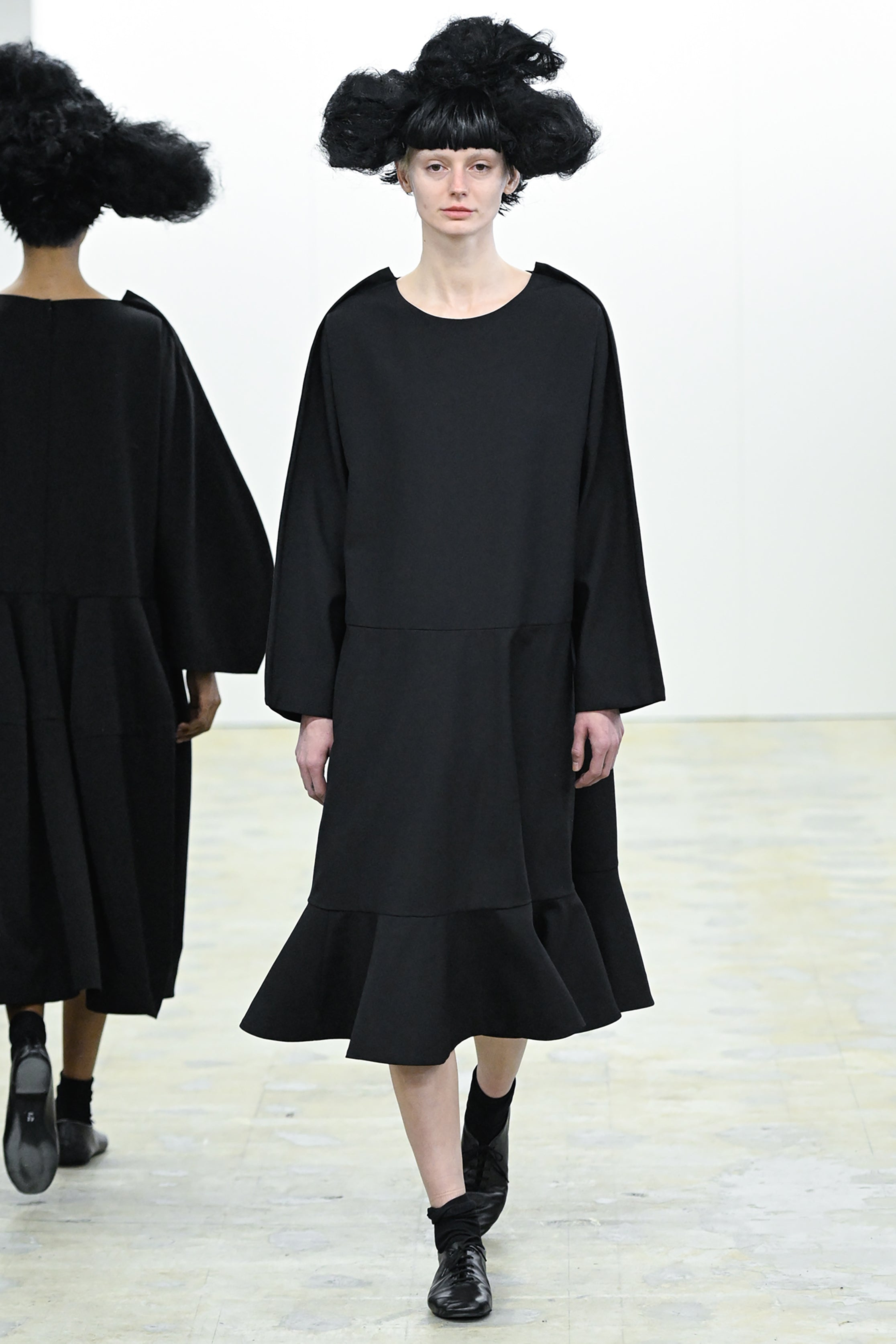 Fashion model wearing a COMME DES GARÇONS COMME DES GARÇONS AW26 outfit