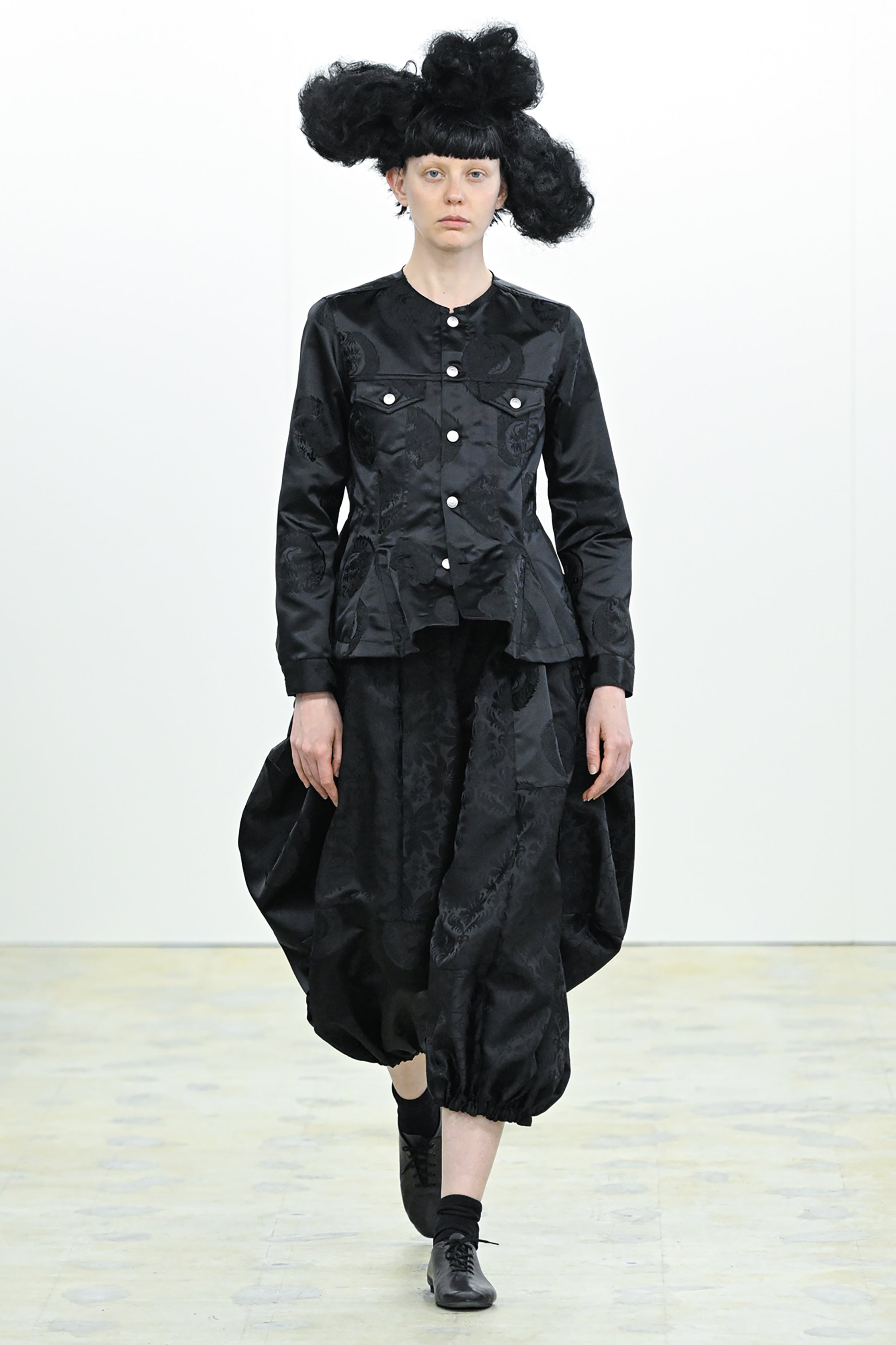 Fashion model wearing a COMME DES GARÇONS COMME DES GARÇONS AW26 outfit