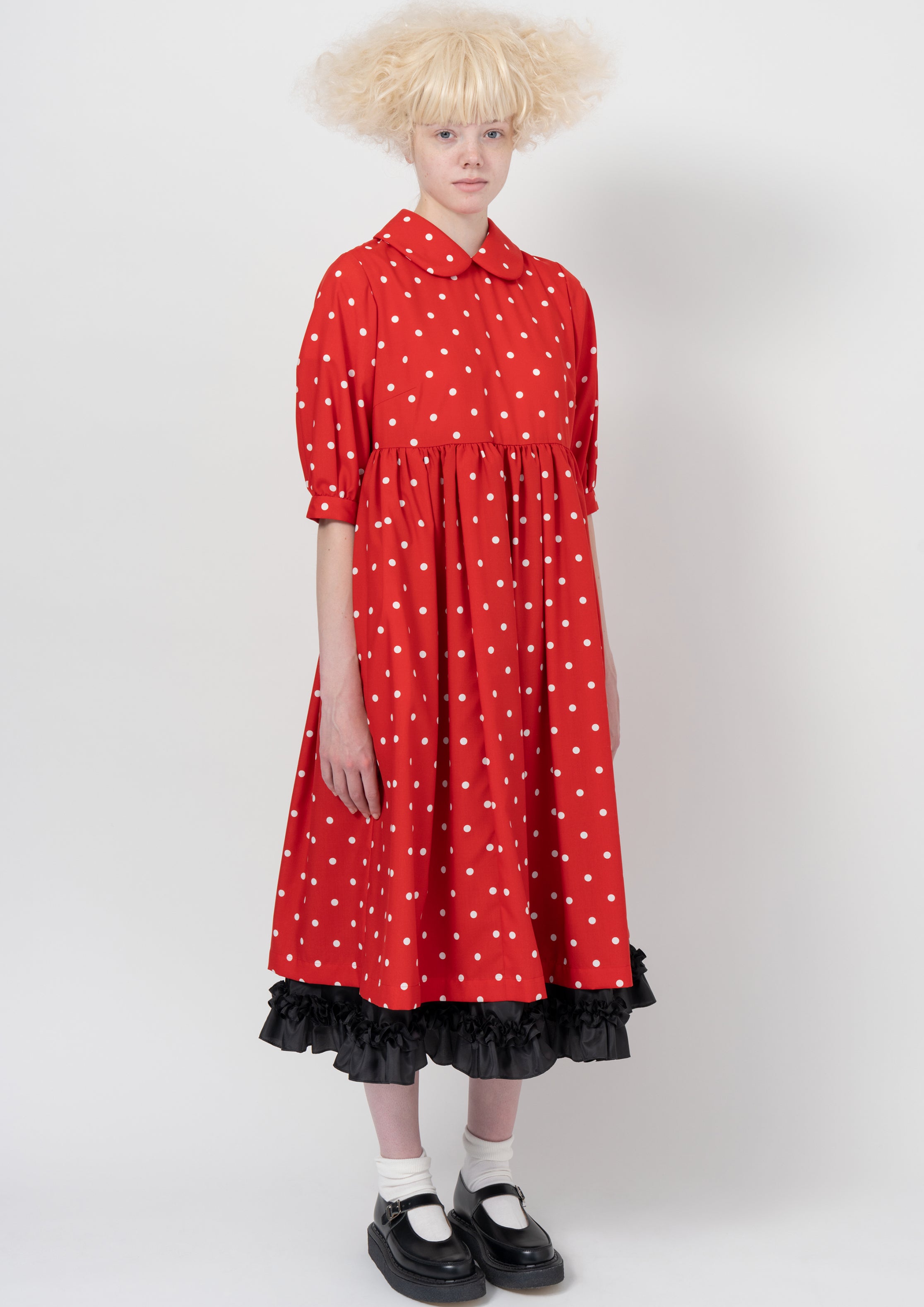 Fashion model wearing a COMME DES GARÇONS GIRL AW26 outfit