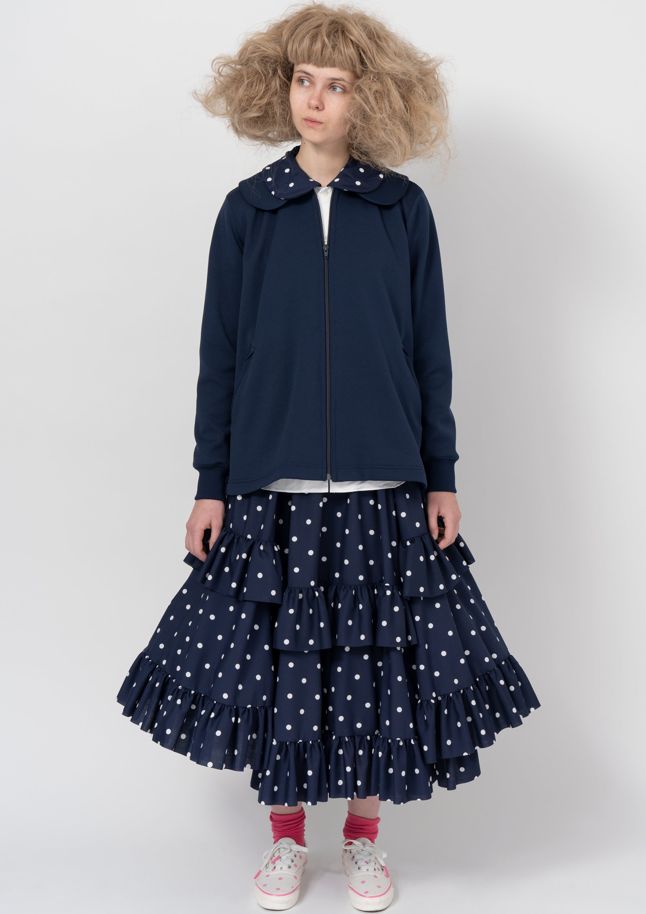Fashion model wearing a COMME DES GARÇONS GIRL AW26 outfit