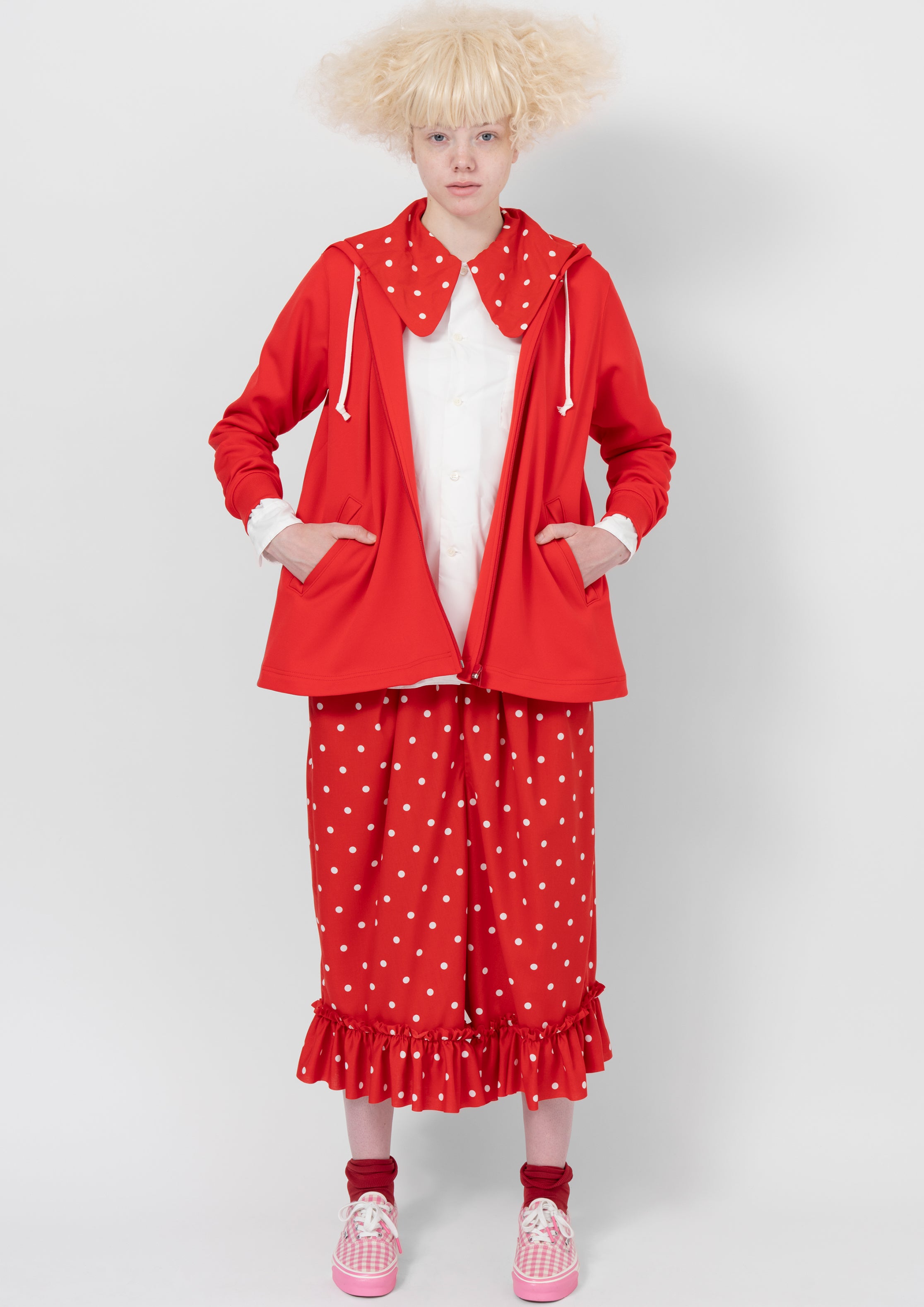 Fashion model wearing a COMME DES GARÇONS GIRL AW26 outfit