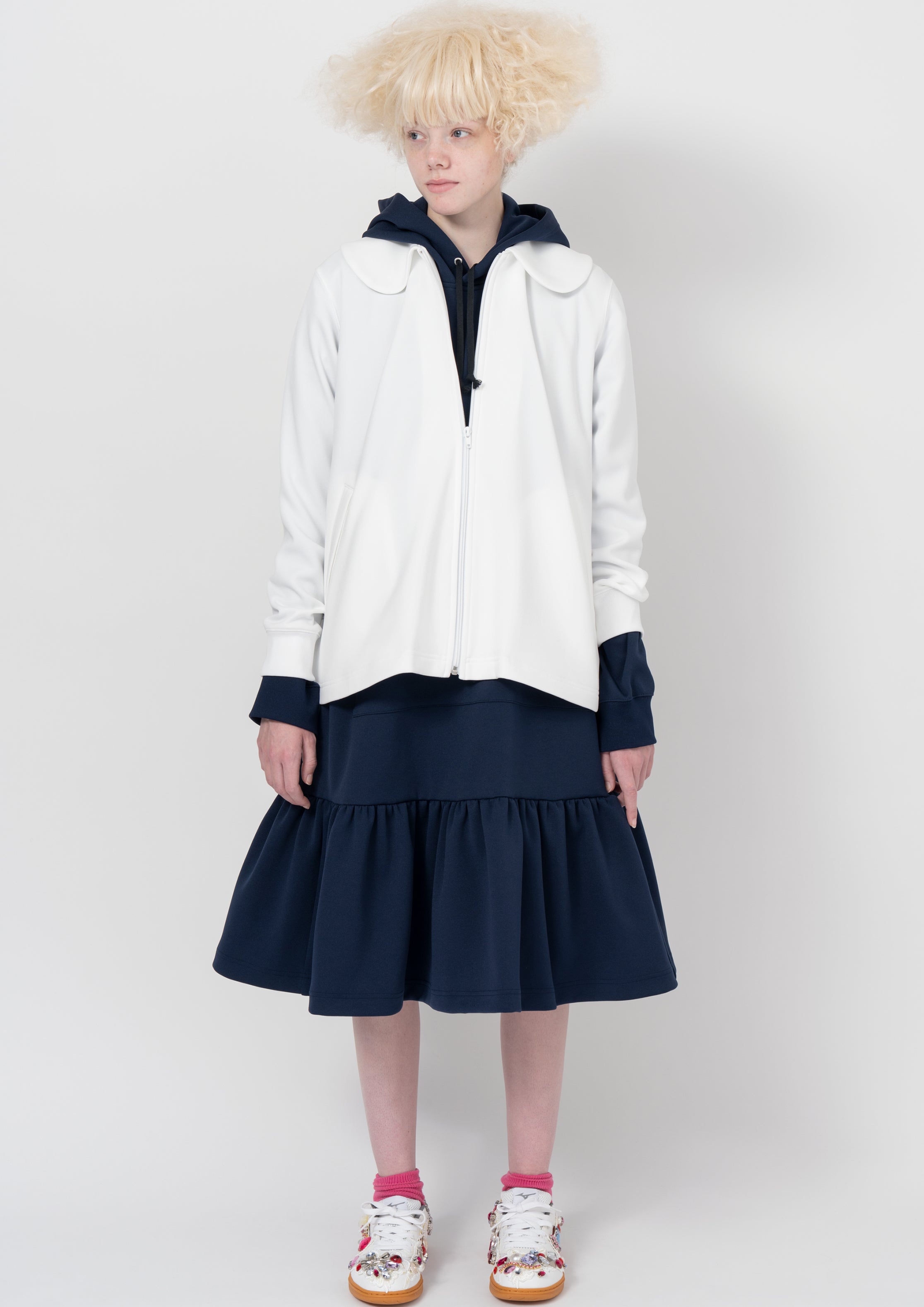 Fashion model wearing a COMME DES GARÇONS GIRL AW26 outfit