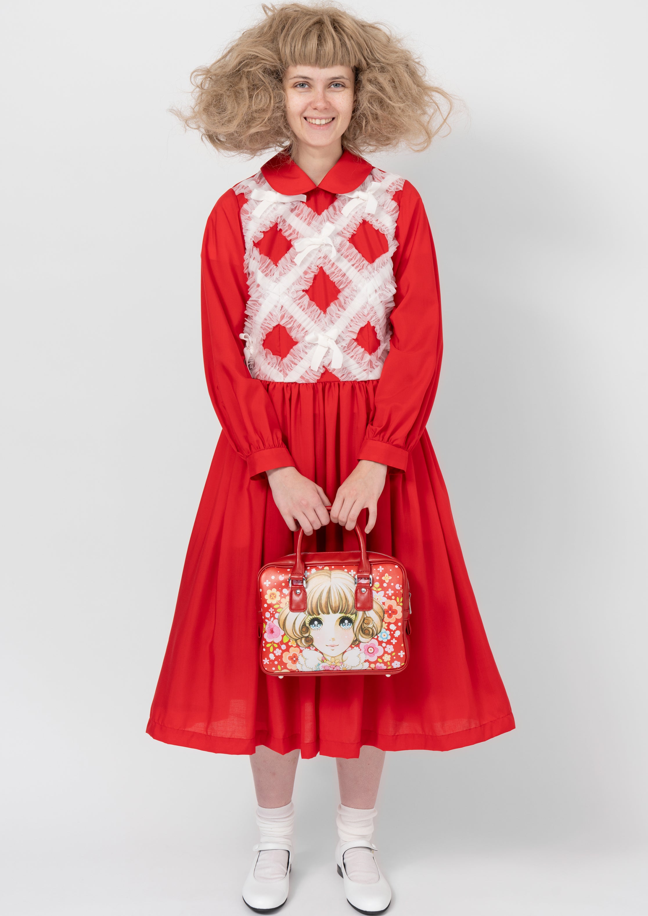 Fashion model wearing a COMME DES GARÇONS GIRL AW26 outfit