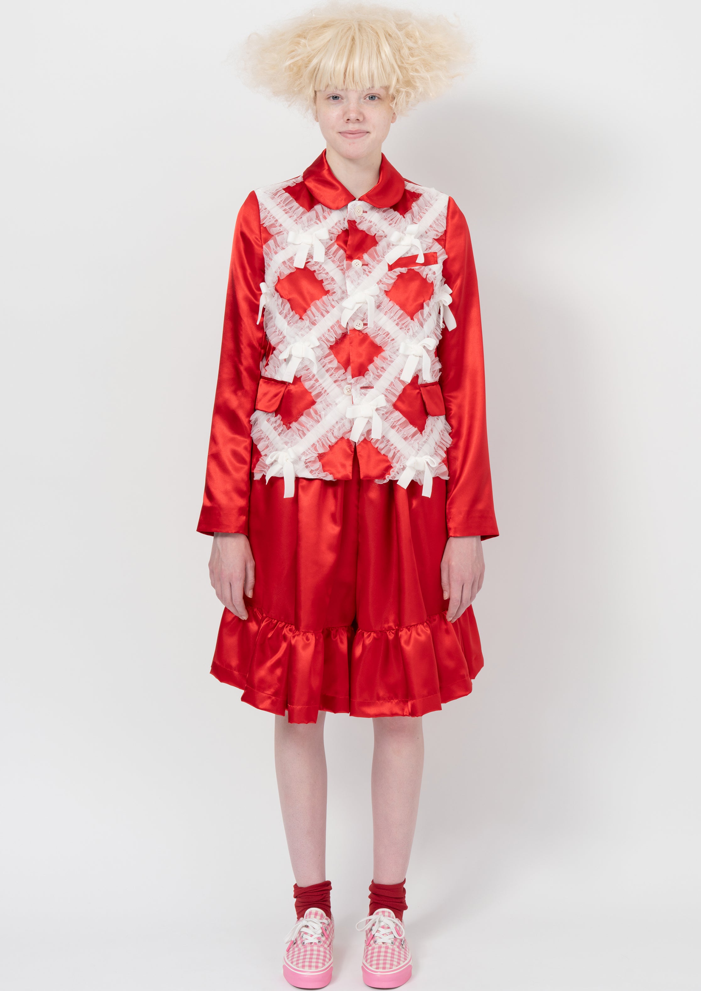 Fashion model wearing a COMME DES GARÇONS GIRL AW26 outfit