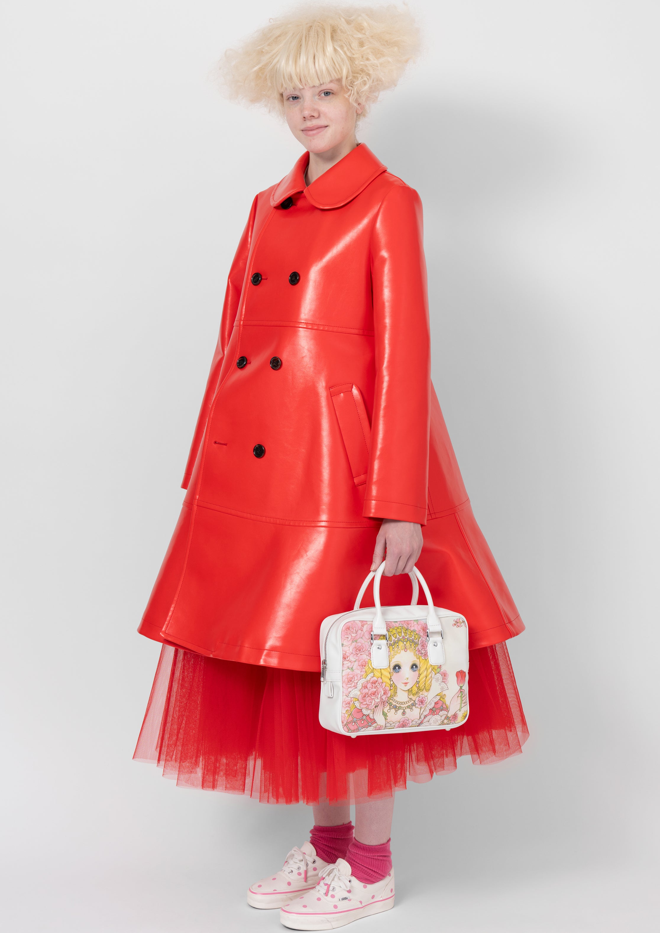 Fashion model wearing a COMME DES GARÇONS GIRL AW26 outfit