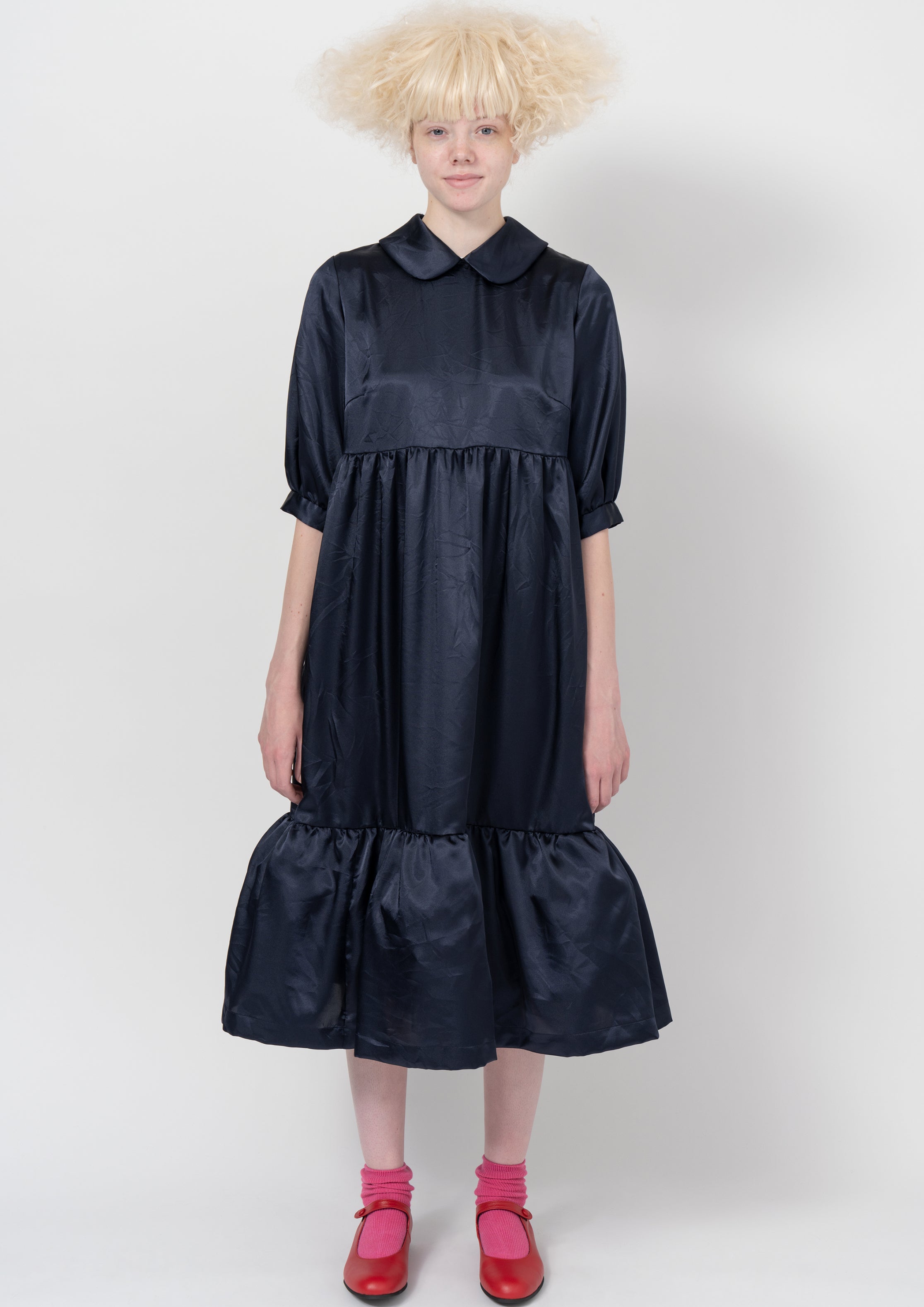 Fashion model wearing a COMME DES GARÇONS GIRL AW26 outfit