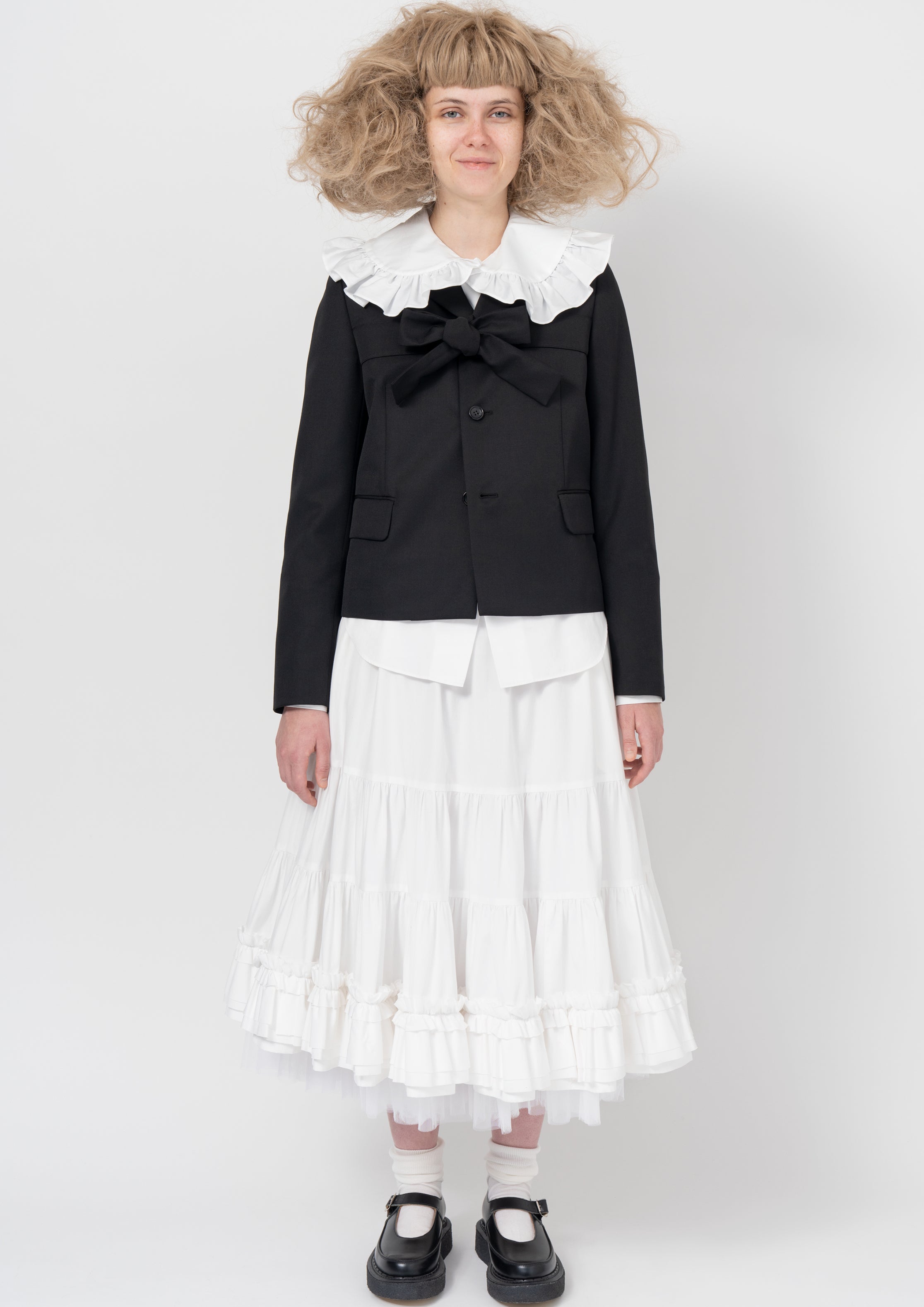 Fashion model wearing a COMME DES GARÇONS GIRL AW26 outfit