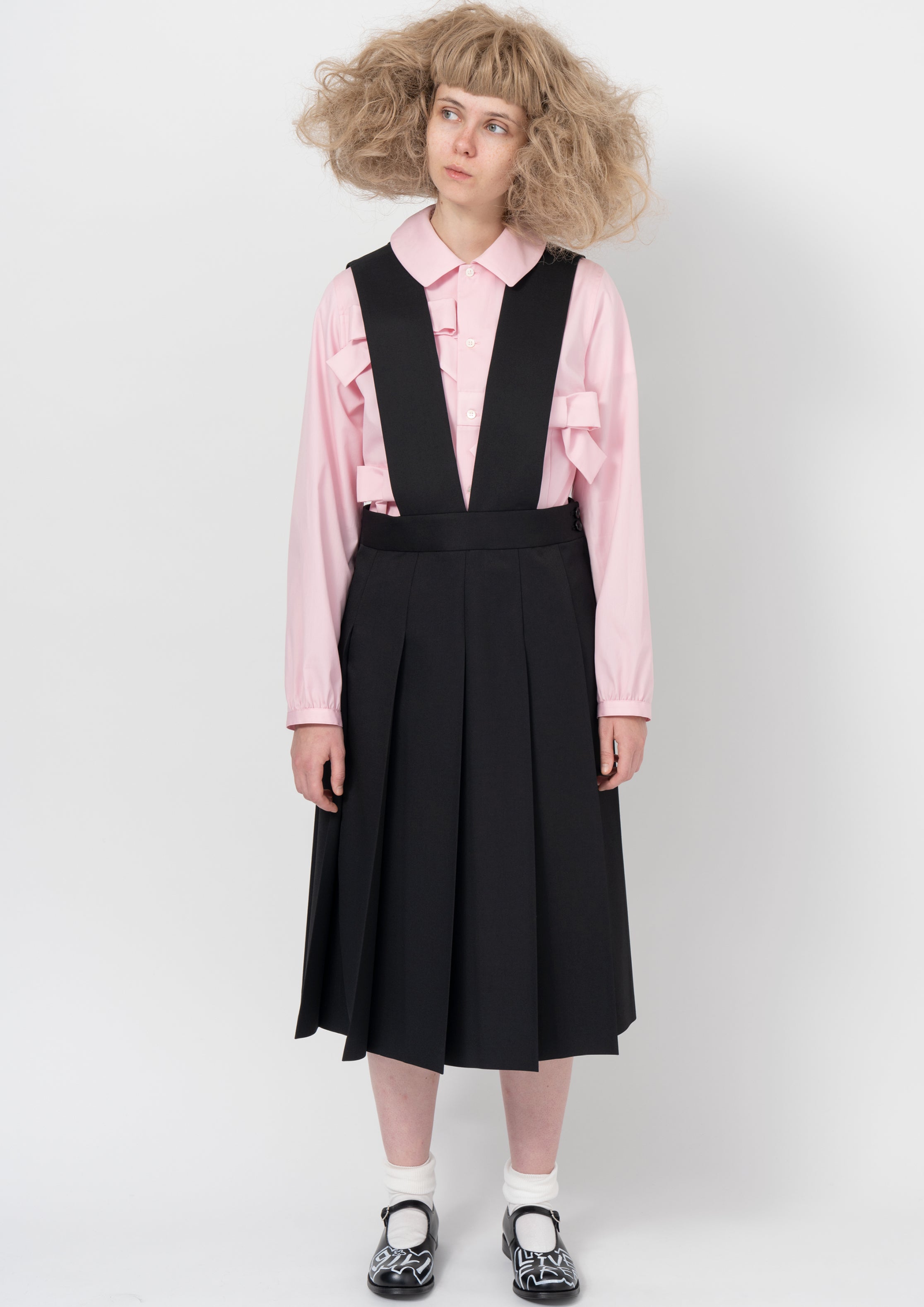 Fashion model wearing a COMME DES GARÇONS GIRL AW26 outfit
