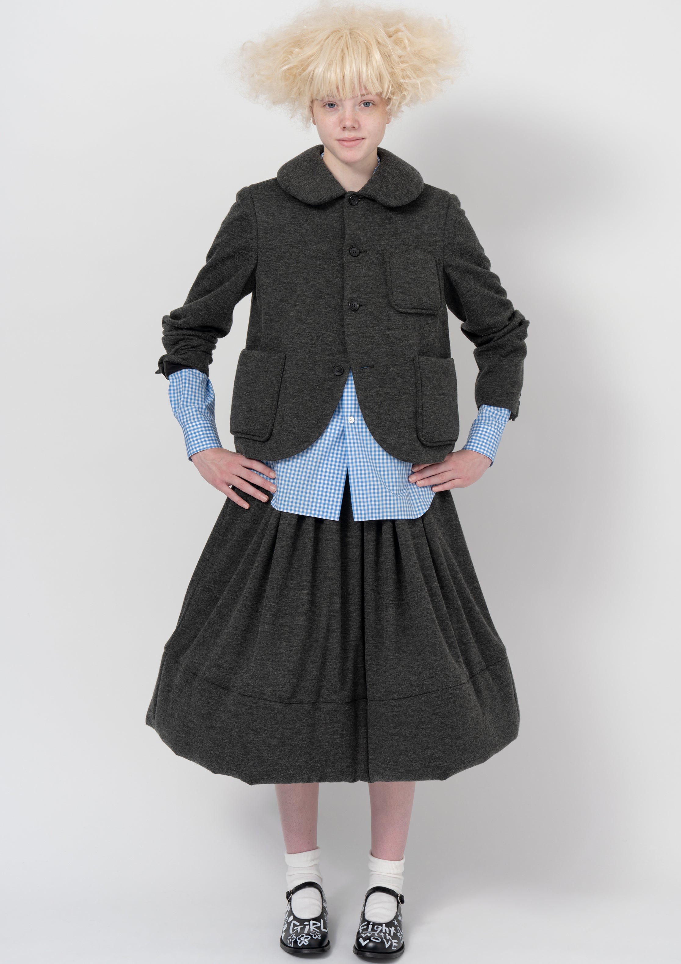Fashion model wearing a COMME DES GARÇONS GIRL AW26 outfit