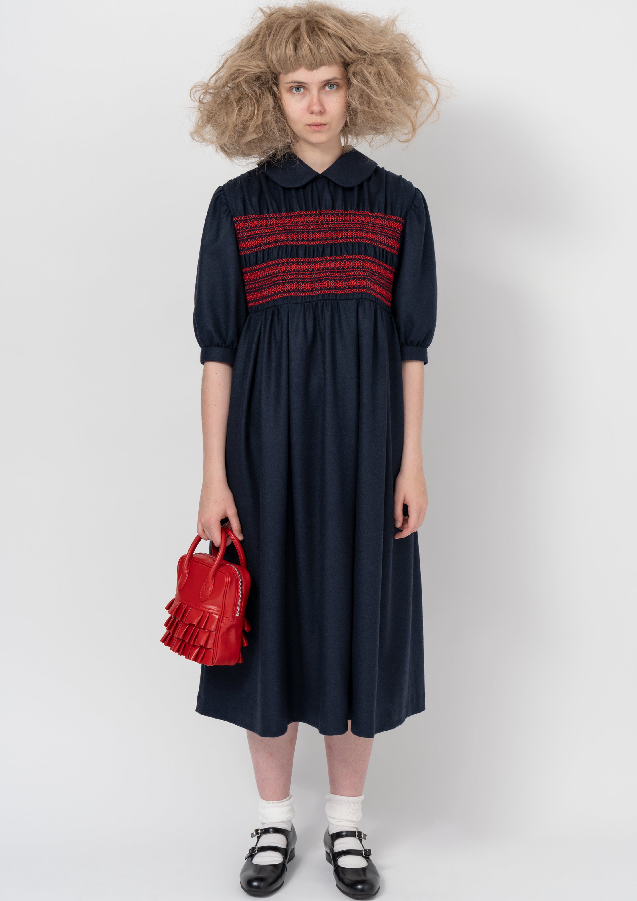 Fashion model wearing a COMME DES GARÇONS GIRL AW26 outfit