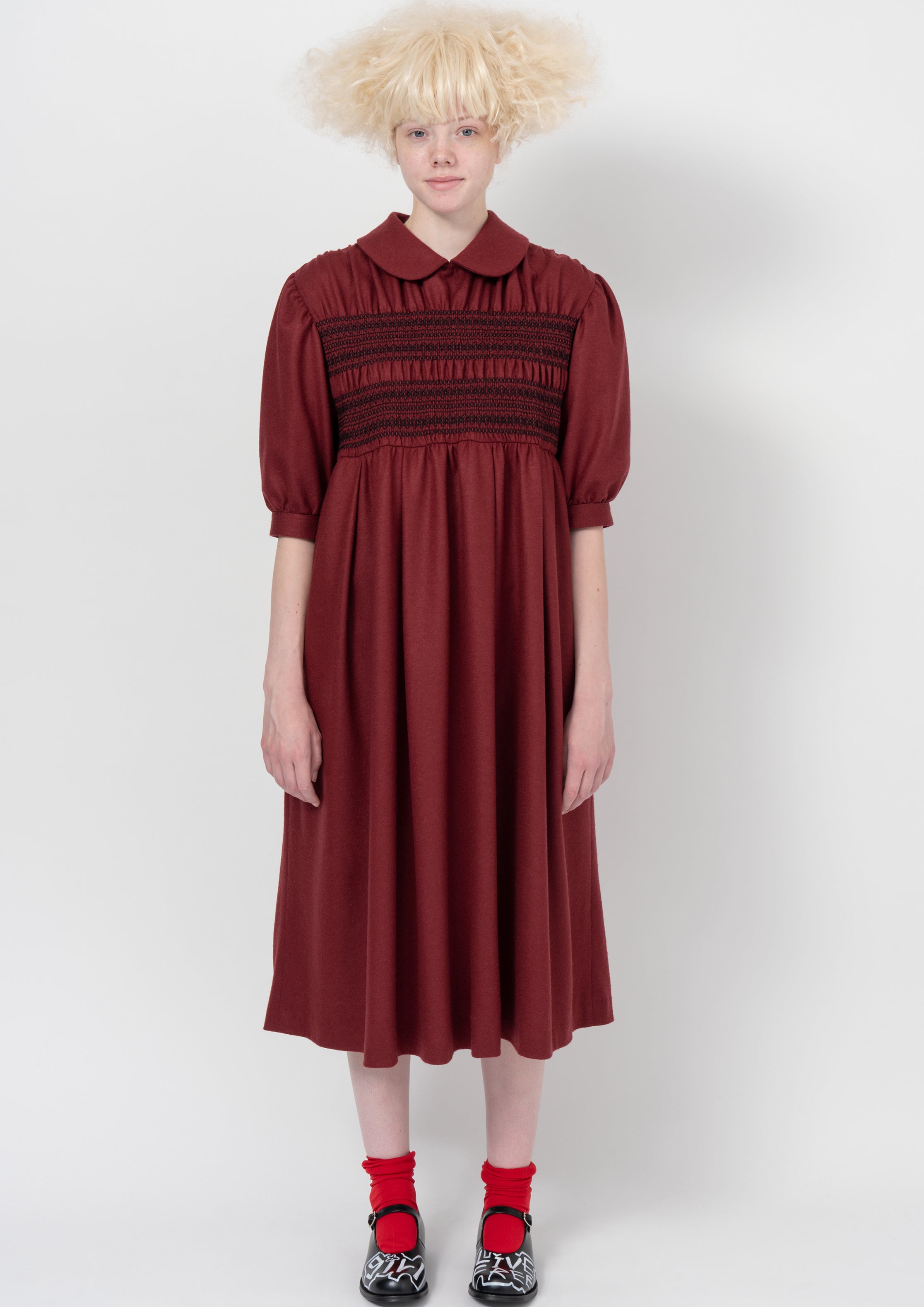 Fashion model wearing a COMME DES GARÇONS GIRL AW26 outfit