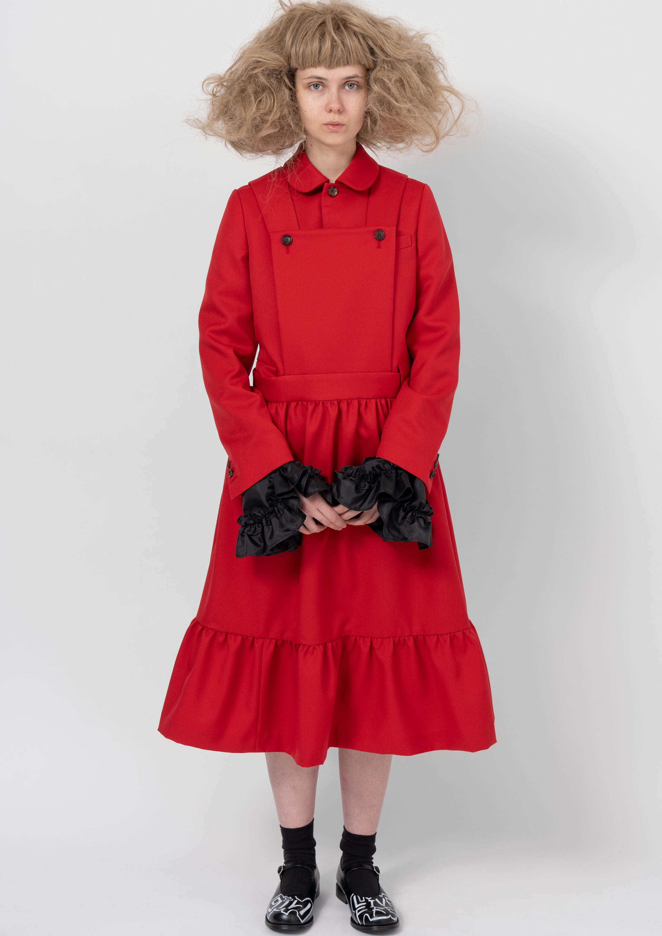 Fashion model wearing a COMME DES GARÇONS GIRL AW26 outfit