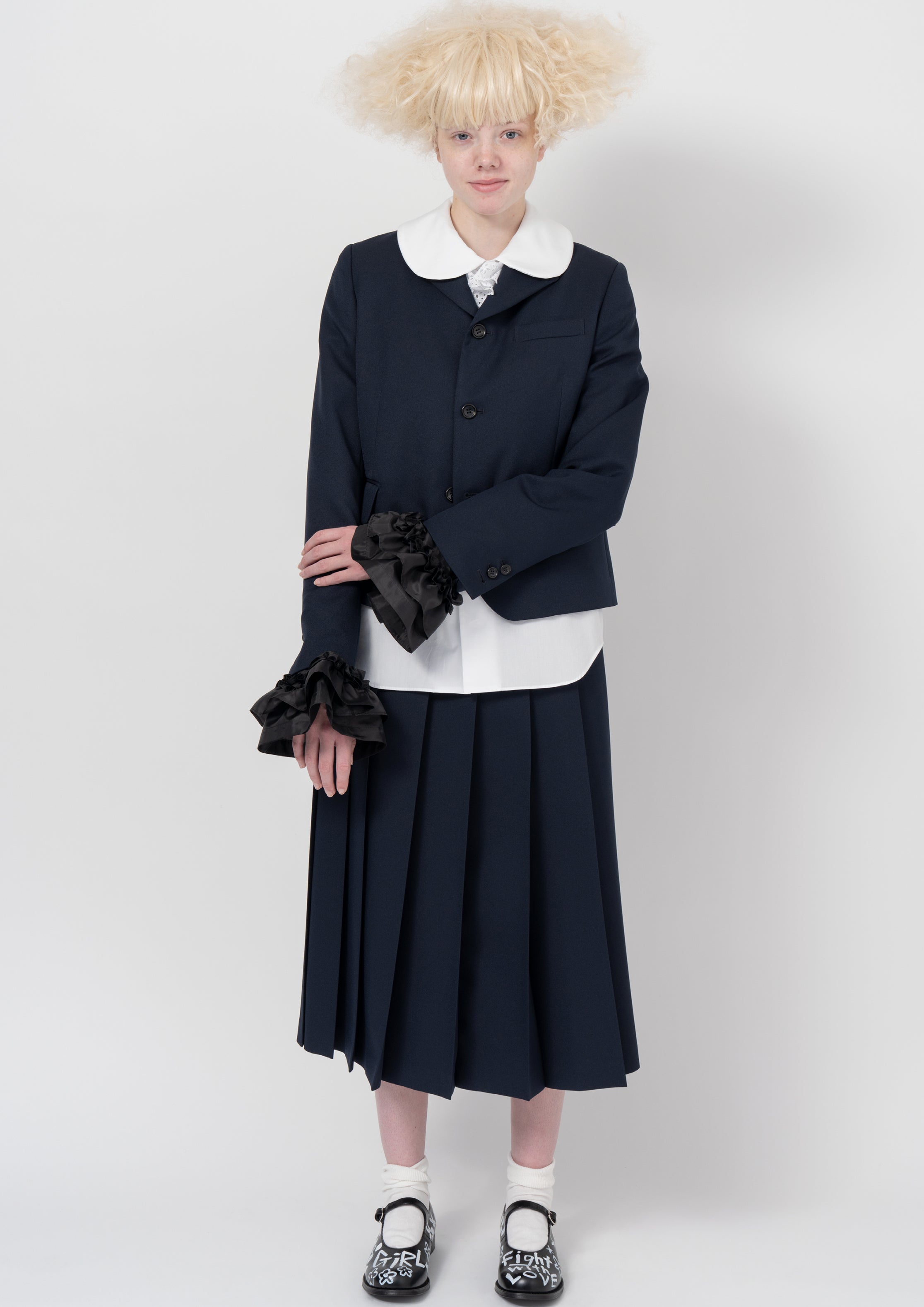 Fashion model wearing a COMME DES GARÇONS GIRL AW26 outfit