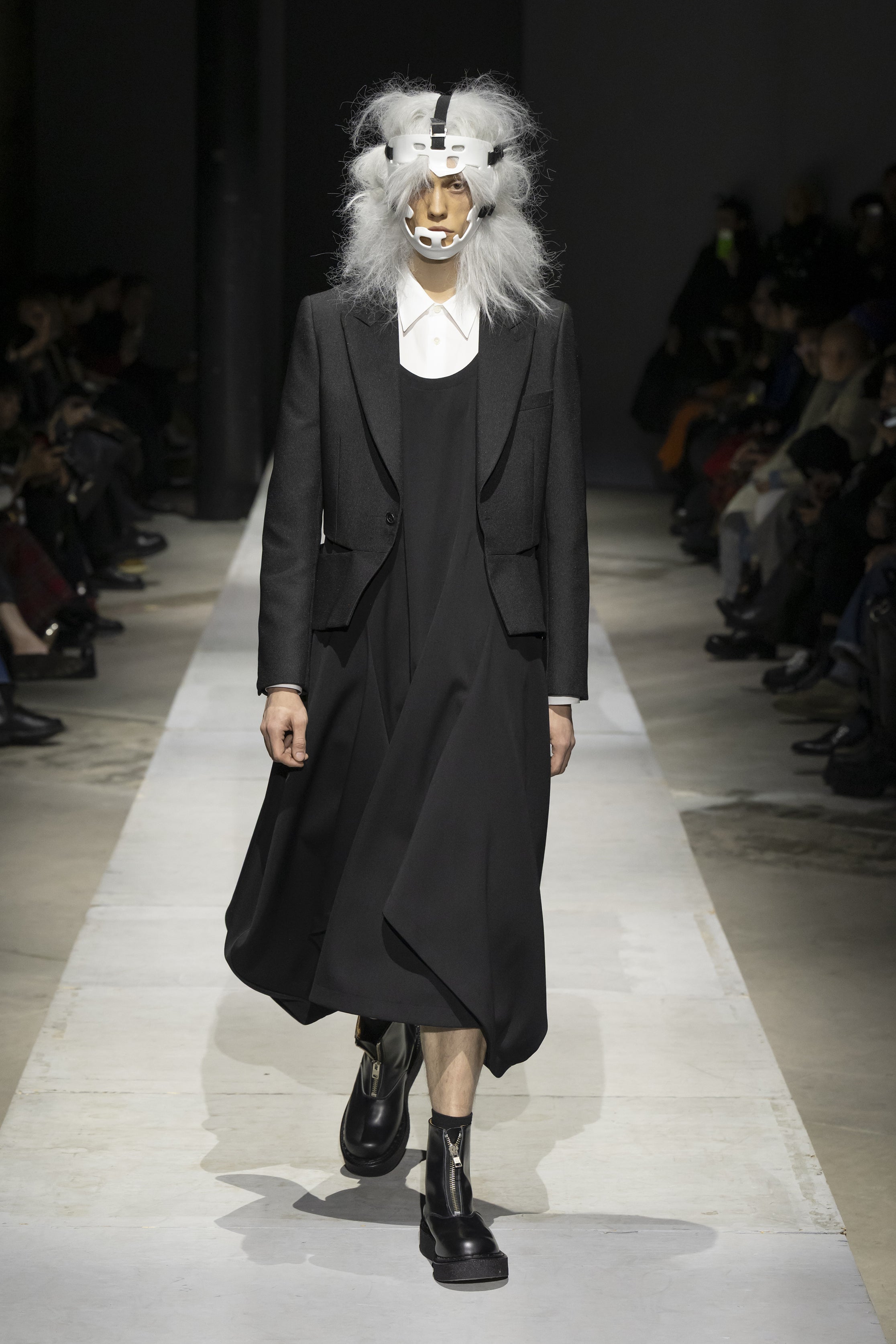 Fashion model wearing a COMME DES GARÇONS HOMME PLUS SS26 outfit