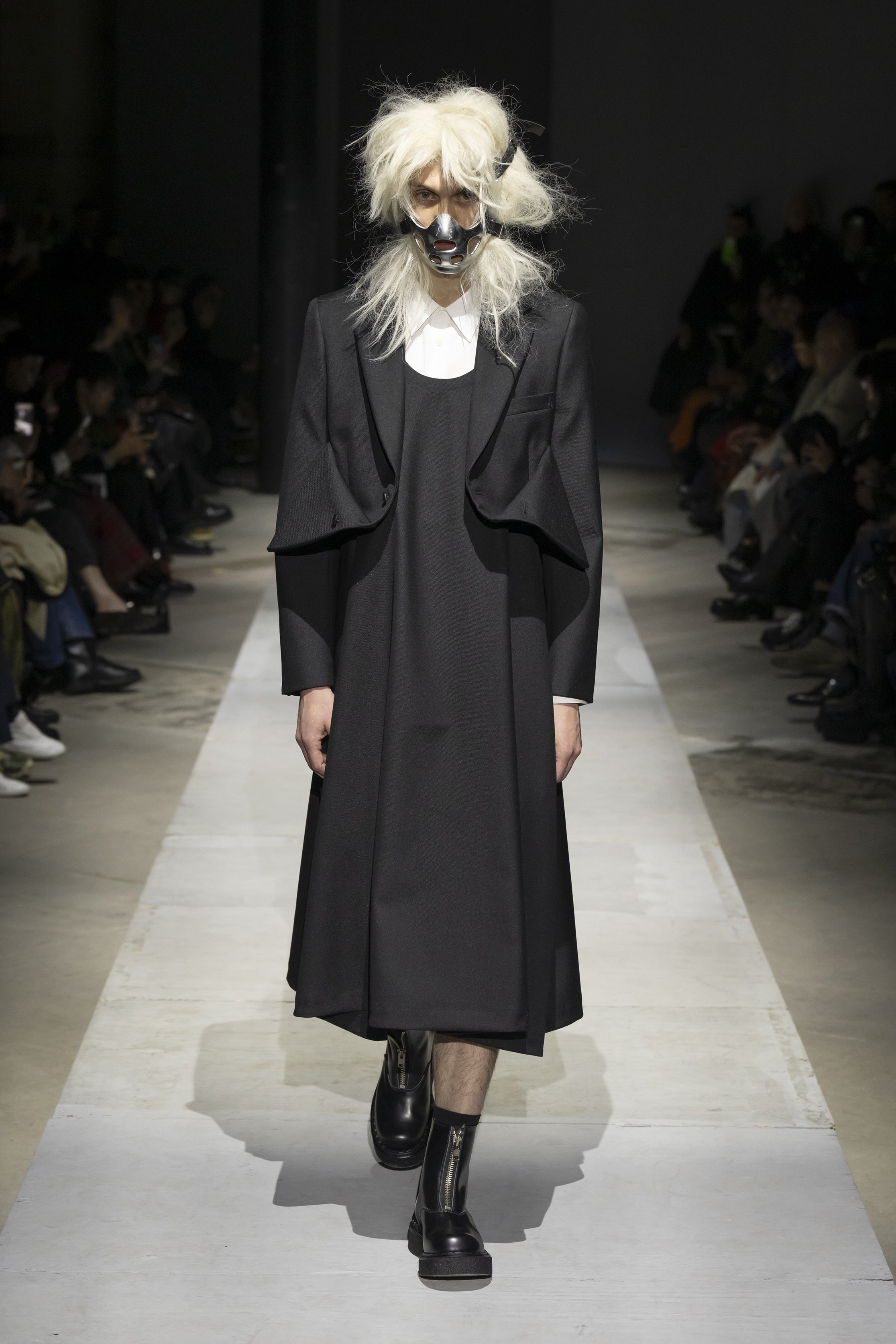 Fashion model wearing a COMME DES GARÇONS HOMME PLUS SS26 outfit
