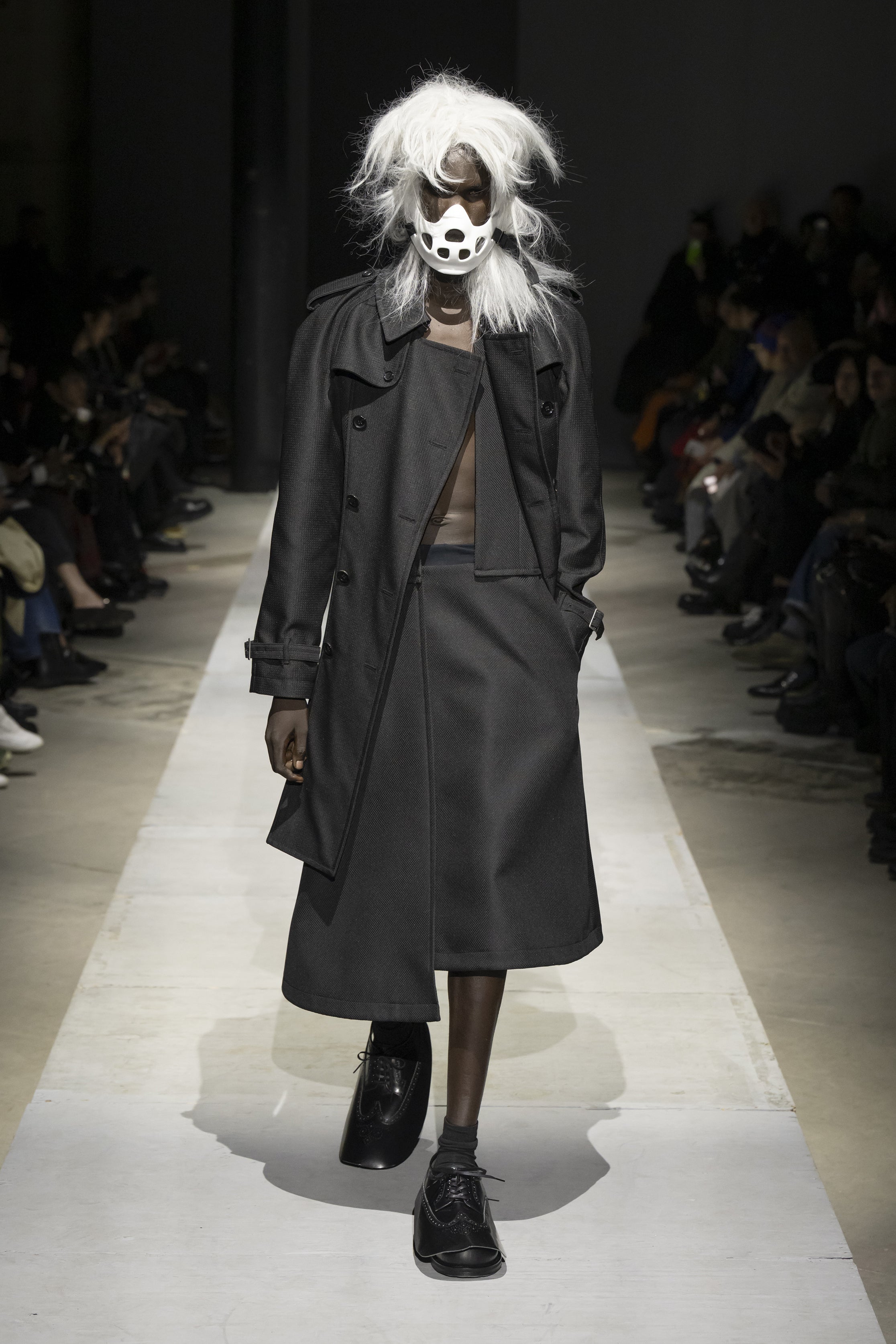 Fashion model wearing a COMME DES GARÇONS HOMME PLUS SS26 outfit