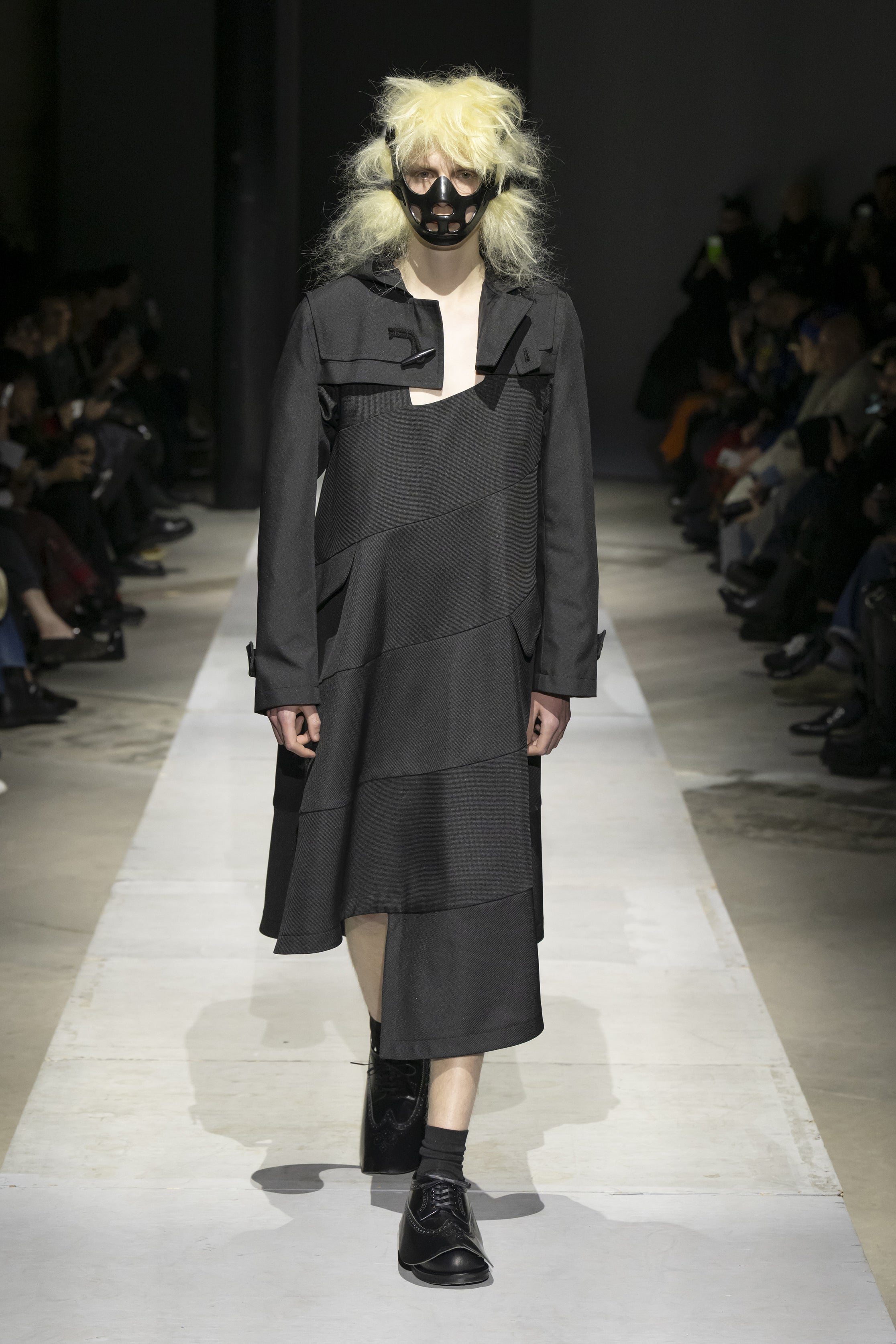 Fashion model wearing a COMME DES GARÇONS HOMME PLUS SS26 outfit