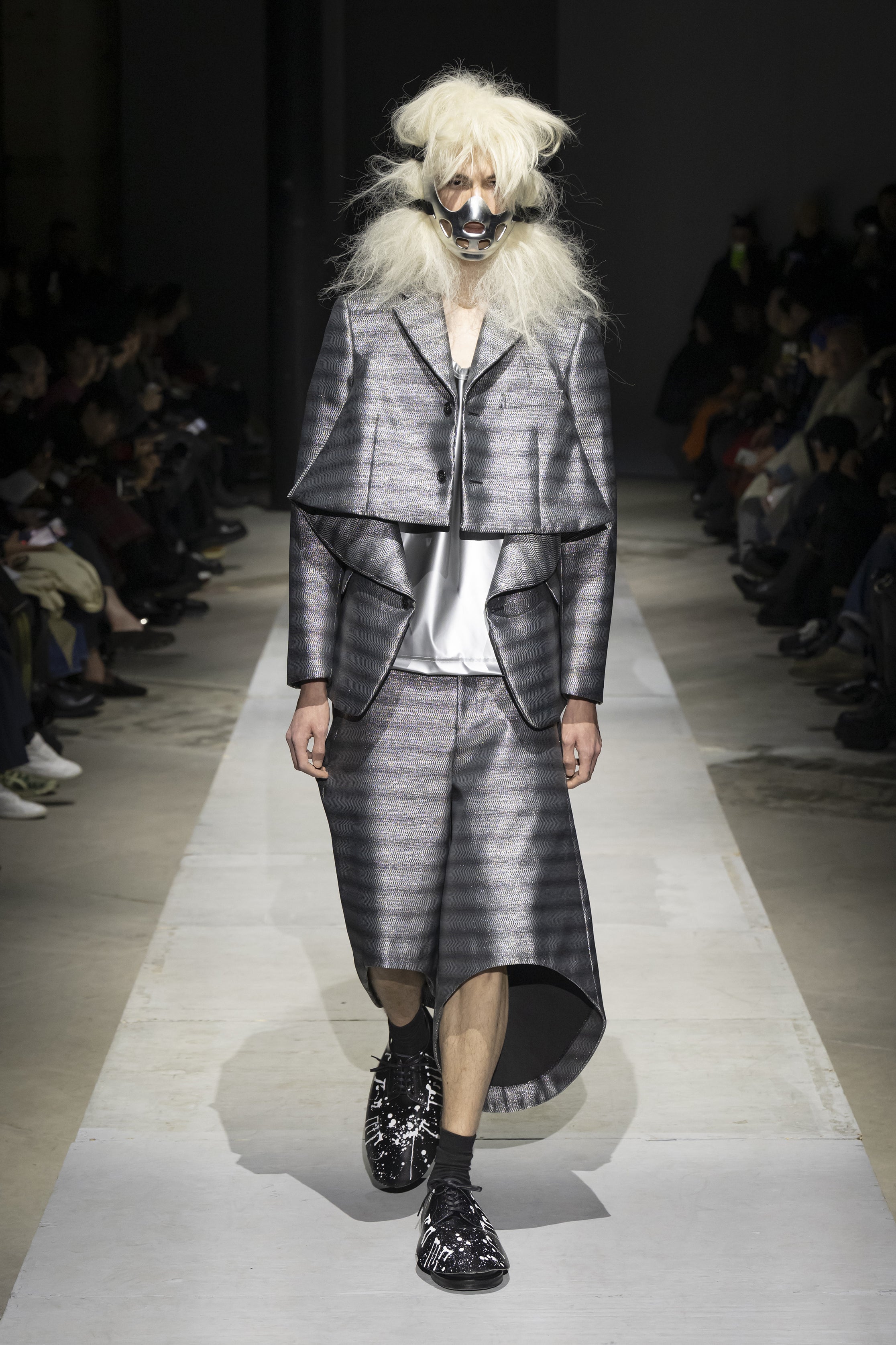 Fashion model wearing a COMME DES GARÇONS HOMME PLUS SS26 outfit