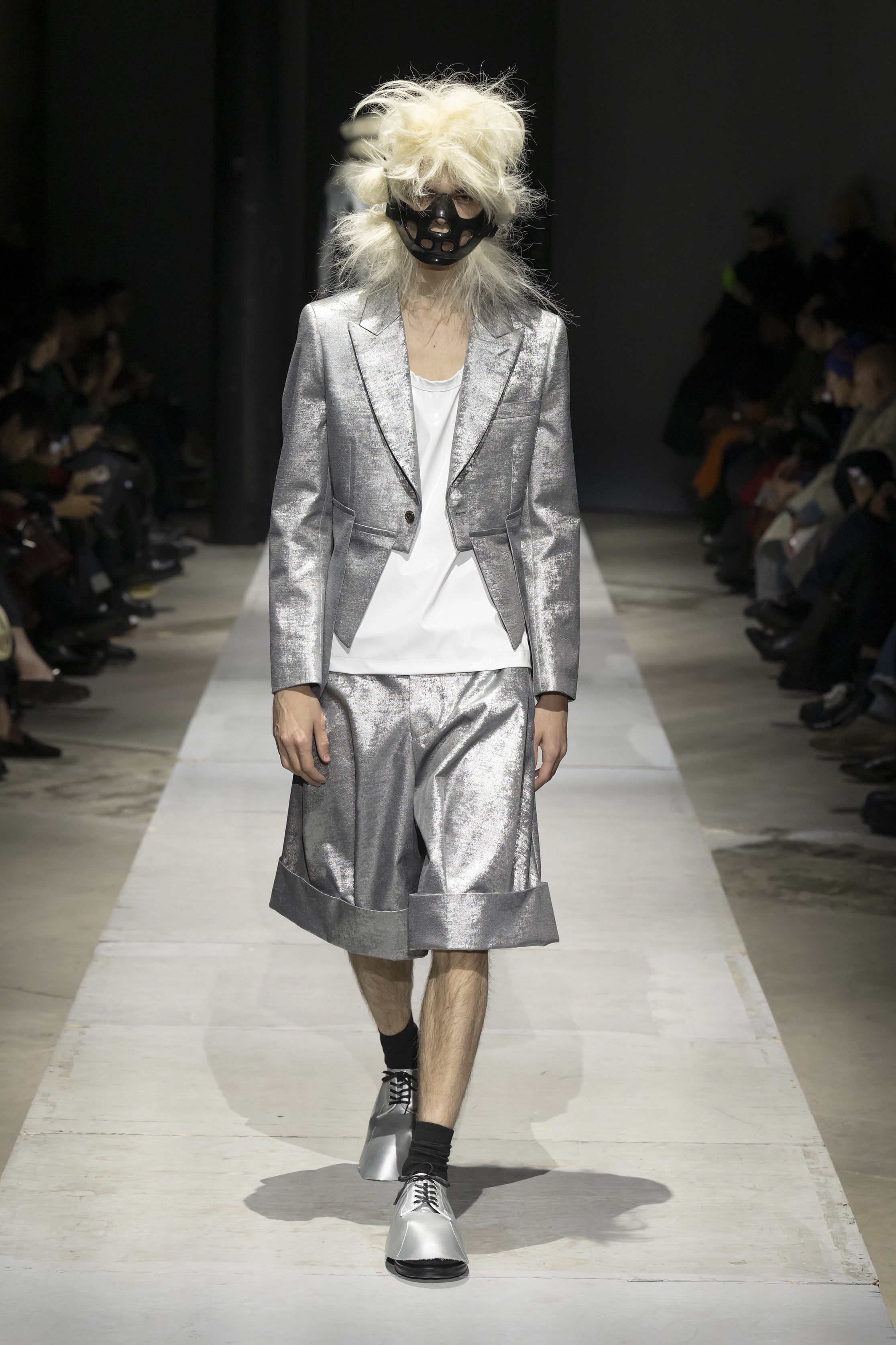 Fashion model wearing a COMME DES GARÇONS HOMME PLUS SS26 outfit