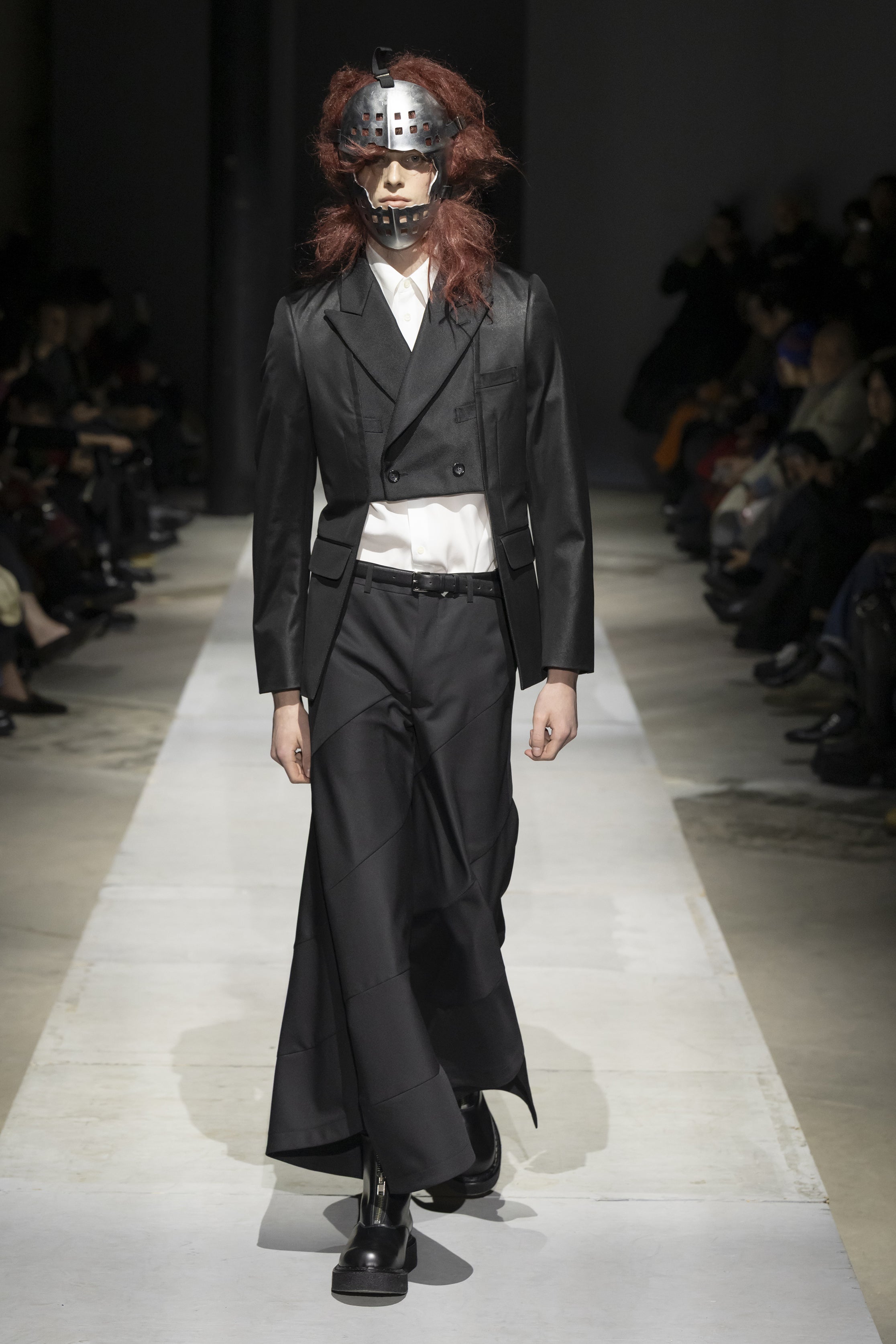Fashion model wearing a COMME DES GARÇONS HOMME PLUS SS26 outfit