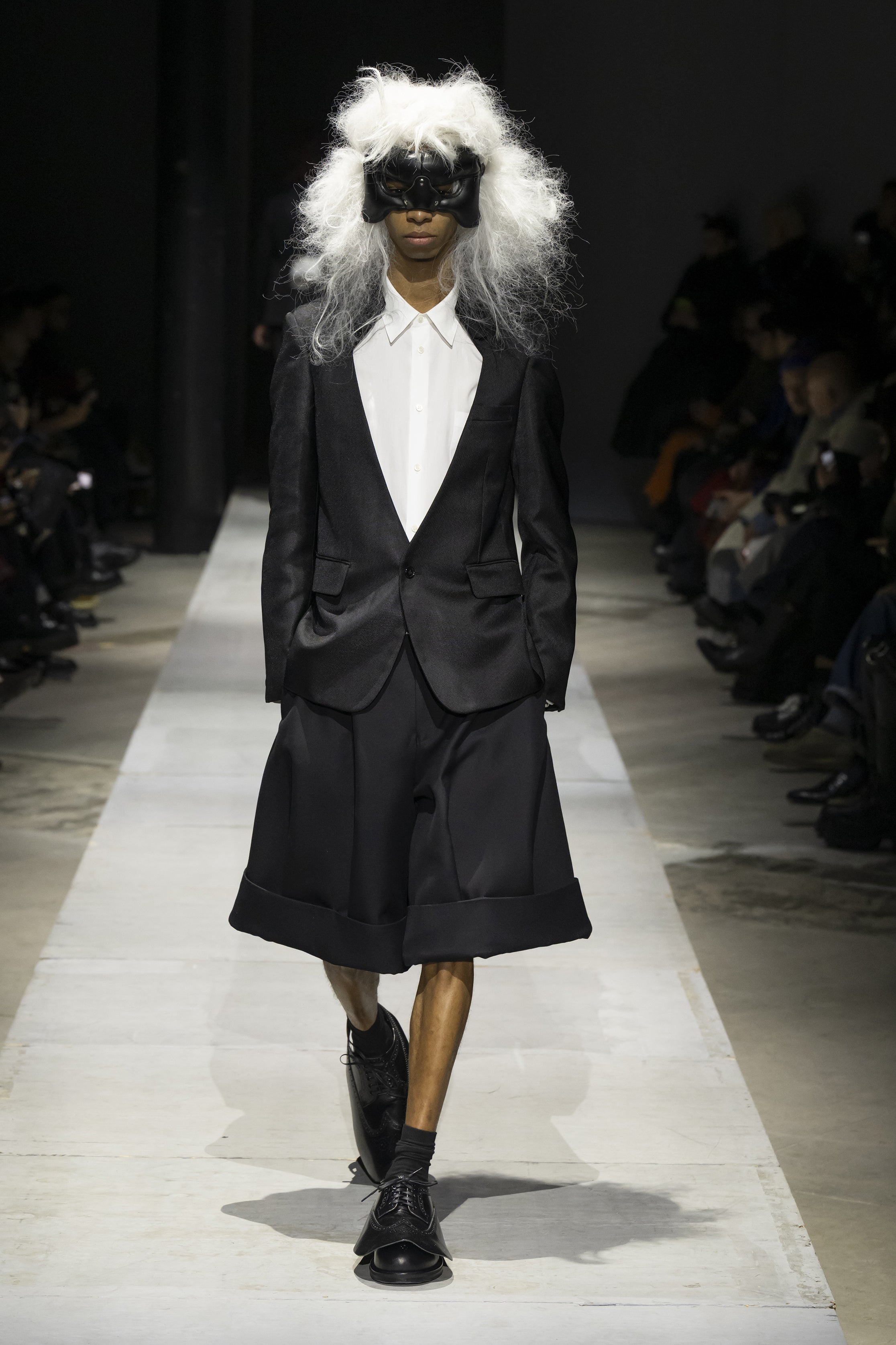 Fashion model wearing a COMME DES GARÇONS HOMME PLUS SS26 outfit