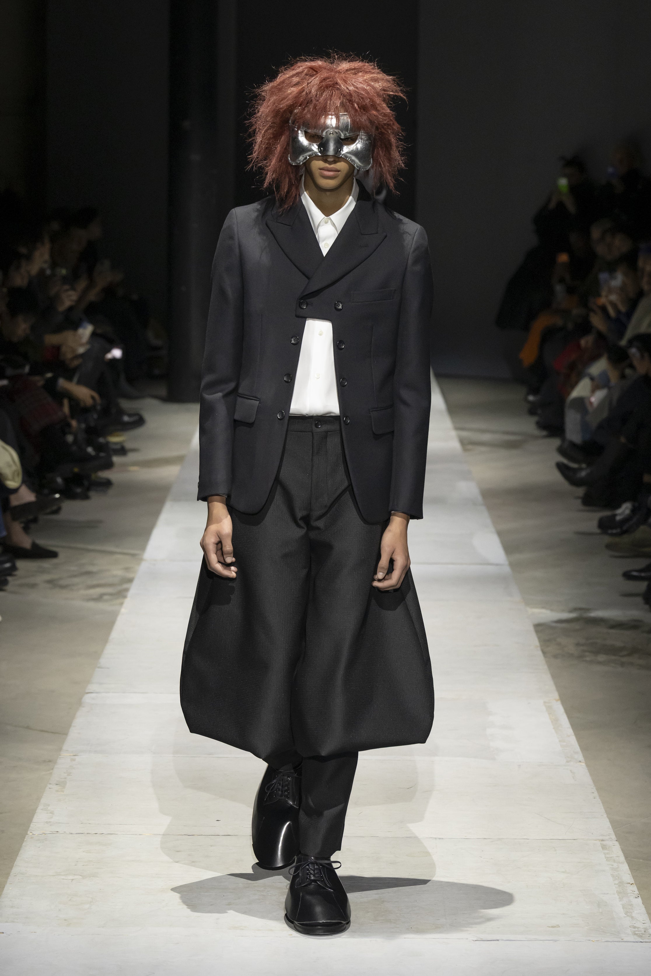 Fashion model wearing a COMME DES GARÇONS HOMME PLUS SS26 outfit