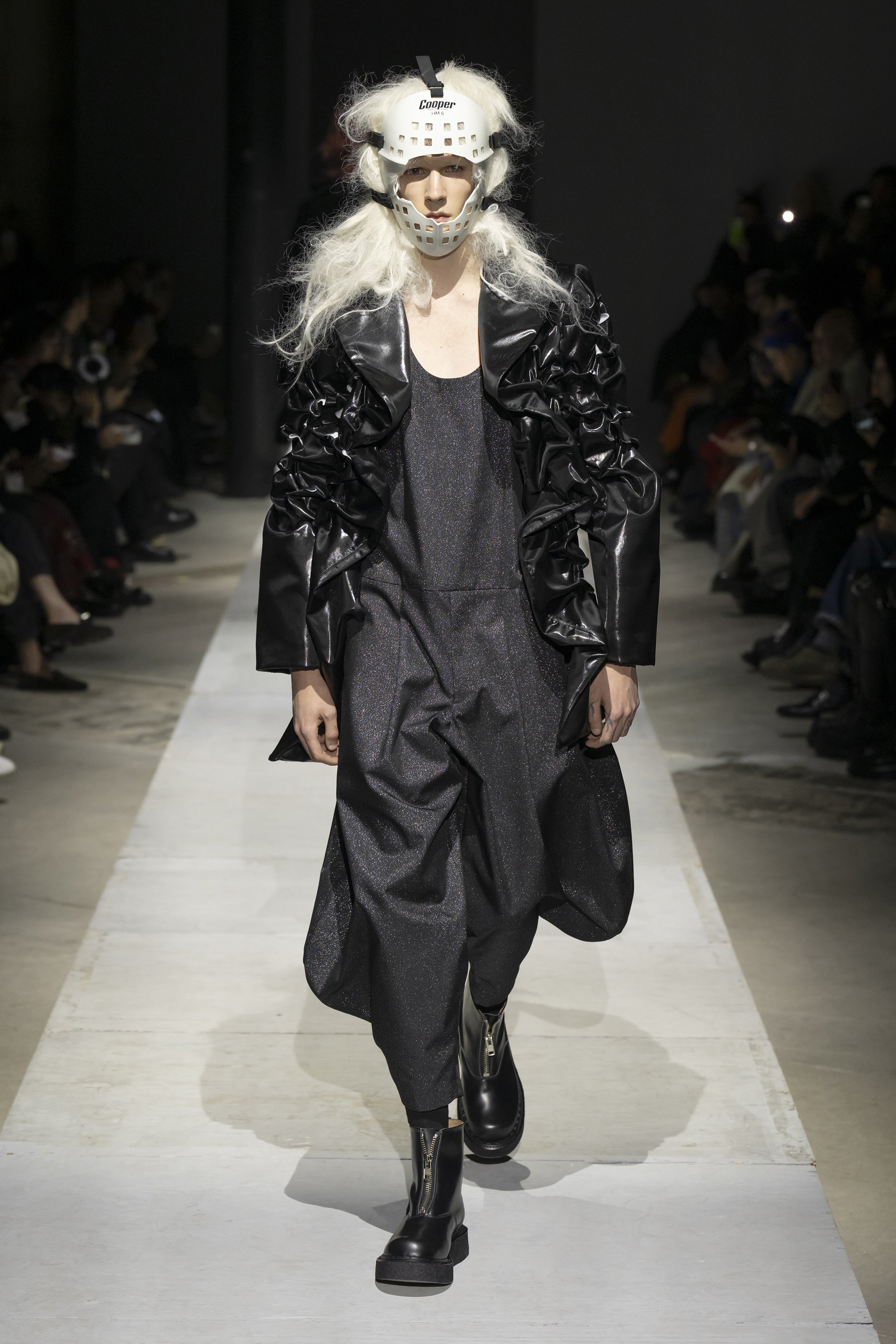Fashion model wearing a COMME DES GARÇONS HOMME PLUS SS26 outfit