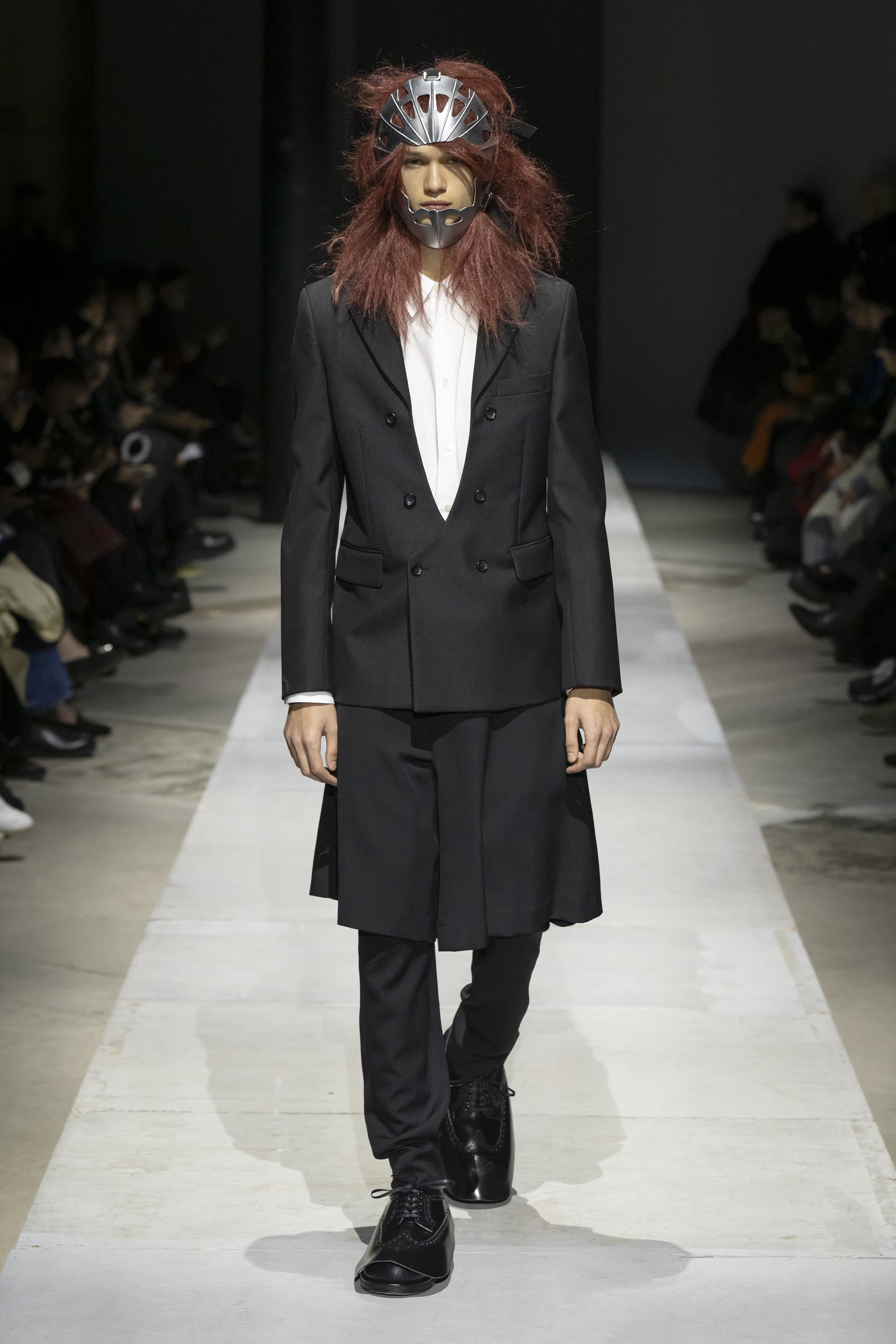 Fashion model wearing a COMME DES GARÇONS HOMME PLUS SS26 outfit