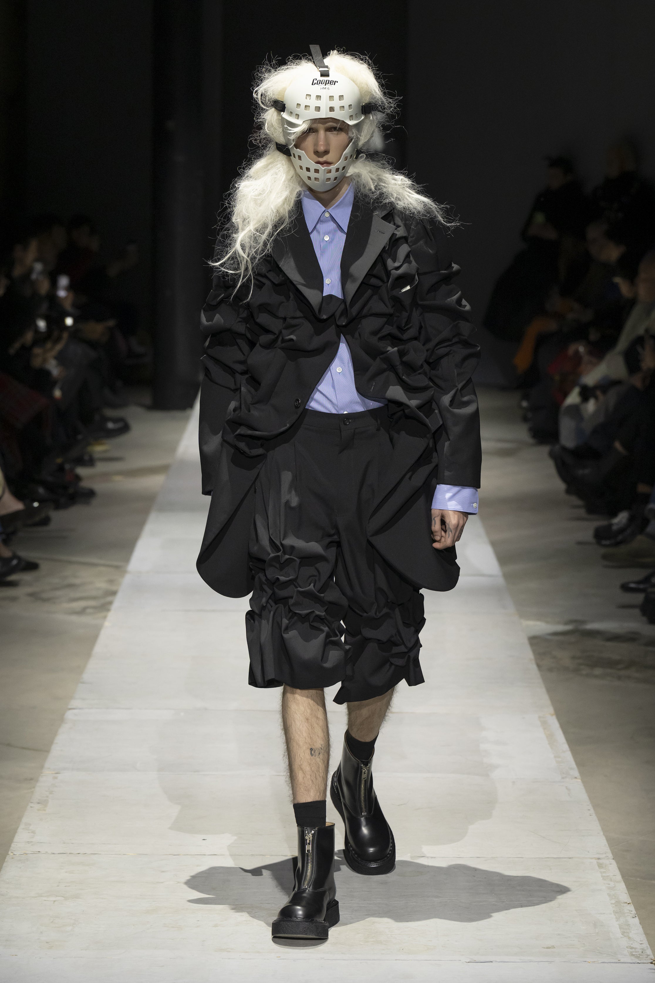Fashion model wearing a COMME DES GARÇONS HOMME PLUS SS26 outfit