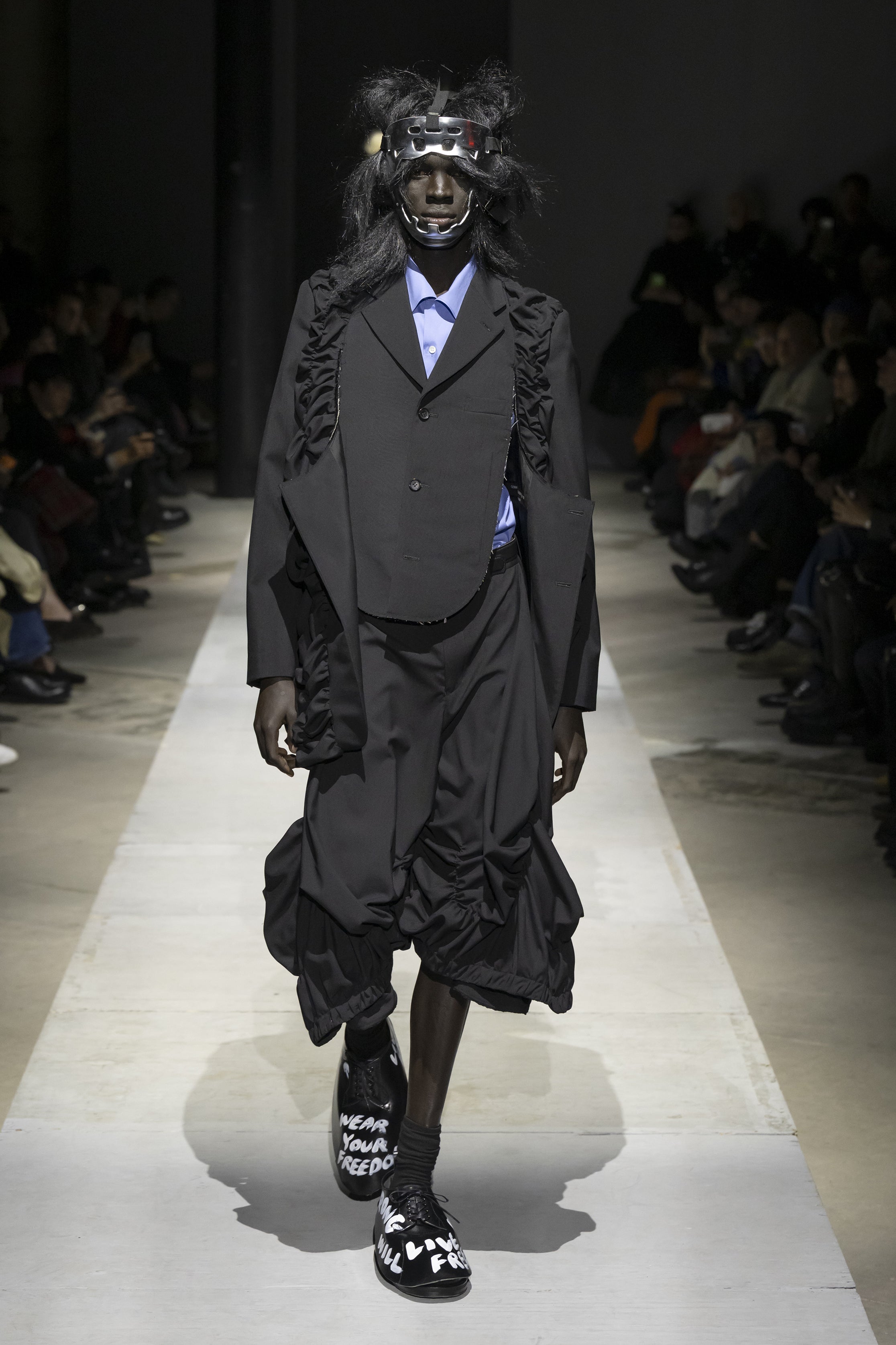 Fashion model wearing a COMME DES GARÇONS HOMME PLUS SS26 outfit