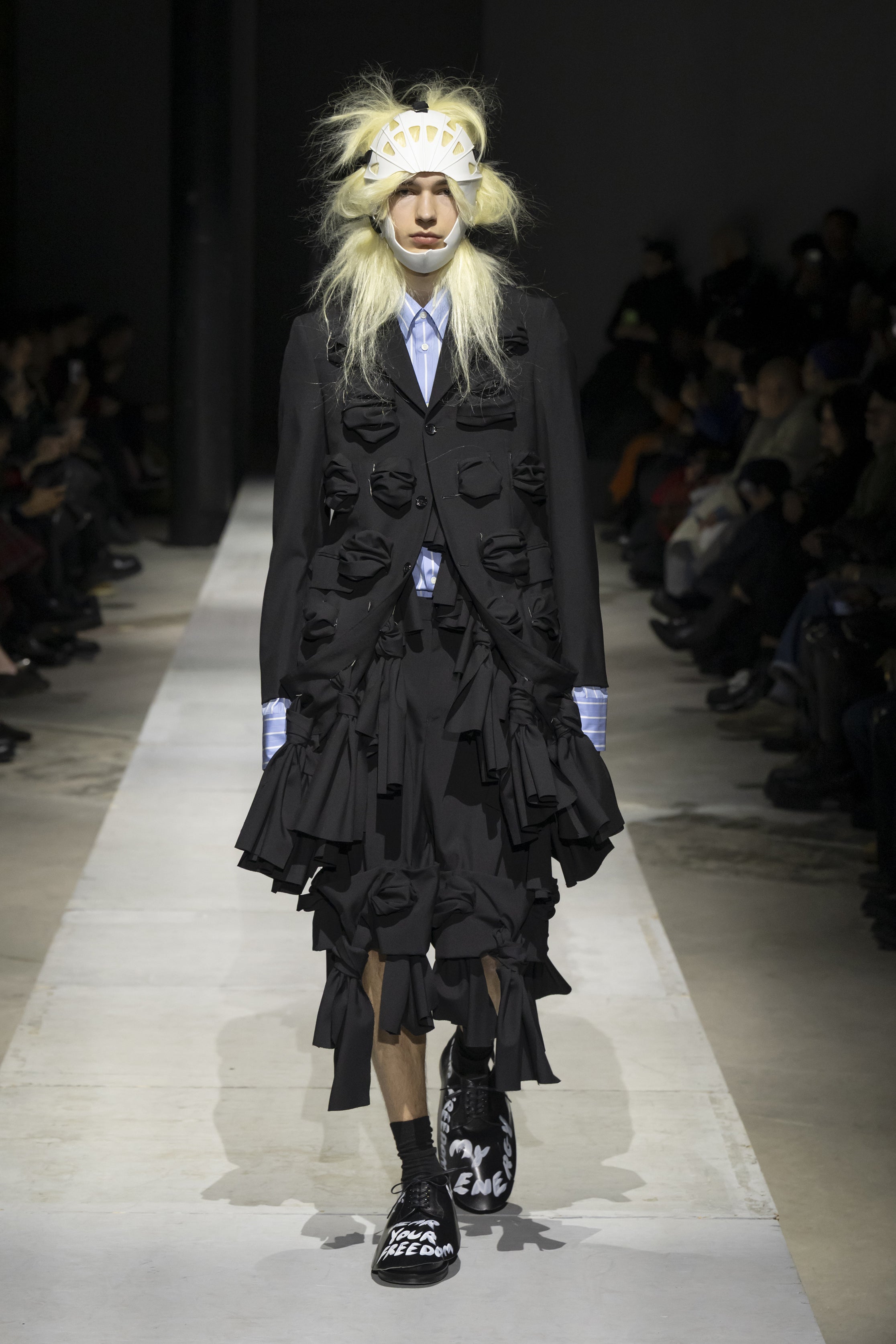 Fashion model wearing a COMME DES GARÇONS HOMME PLUS SS26 outfit