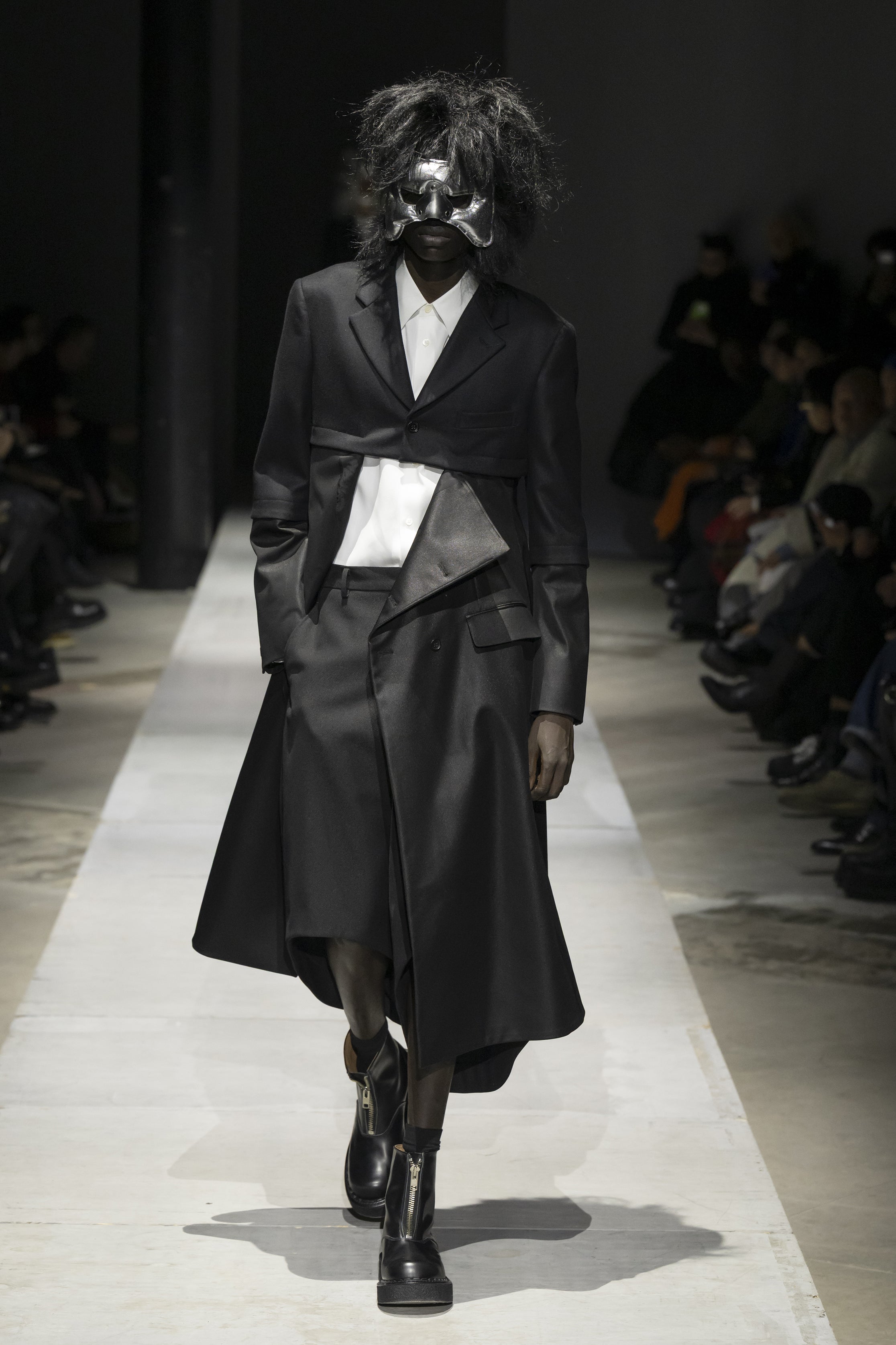 Fashion model wearing a COMME DES GARÇONS HOMME PLUS SS26 outfit
