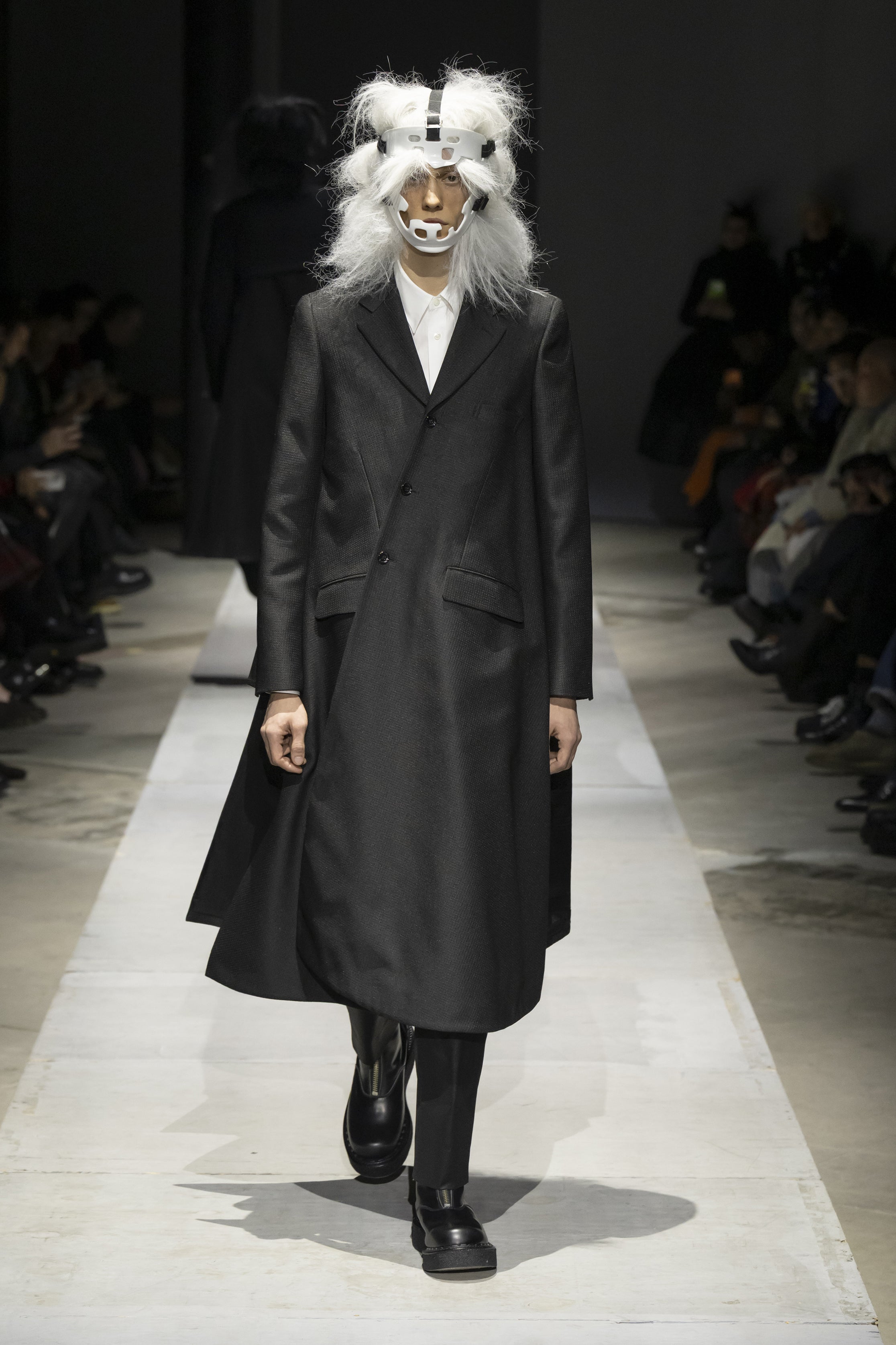 Fashion model wearing a COMME DES GARÇONS HOMME PLUS SS26 outfit
